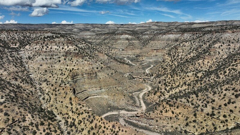 The Trump administration has been sued over its plan to blast famed cliffs in eastern Utah that contain historic inscriptions to make way for an oil-transporting highway