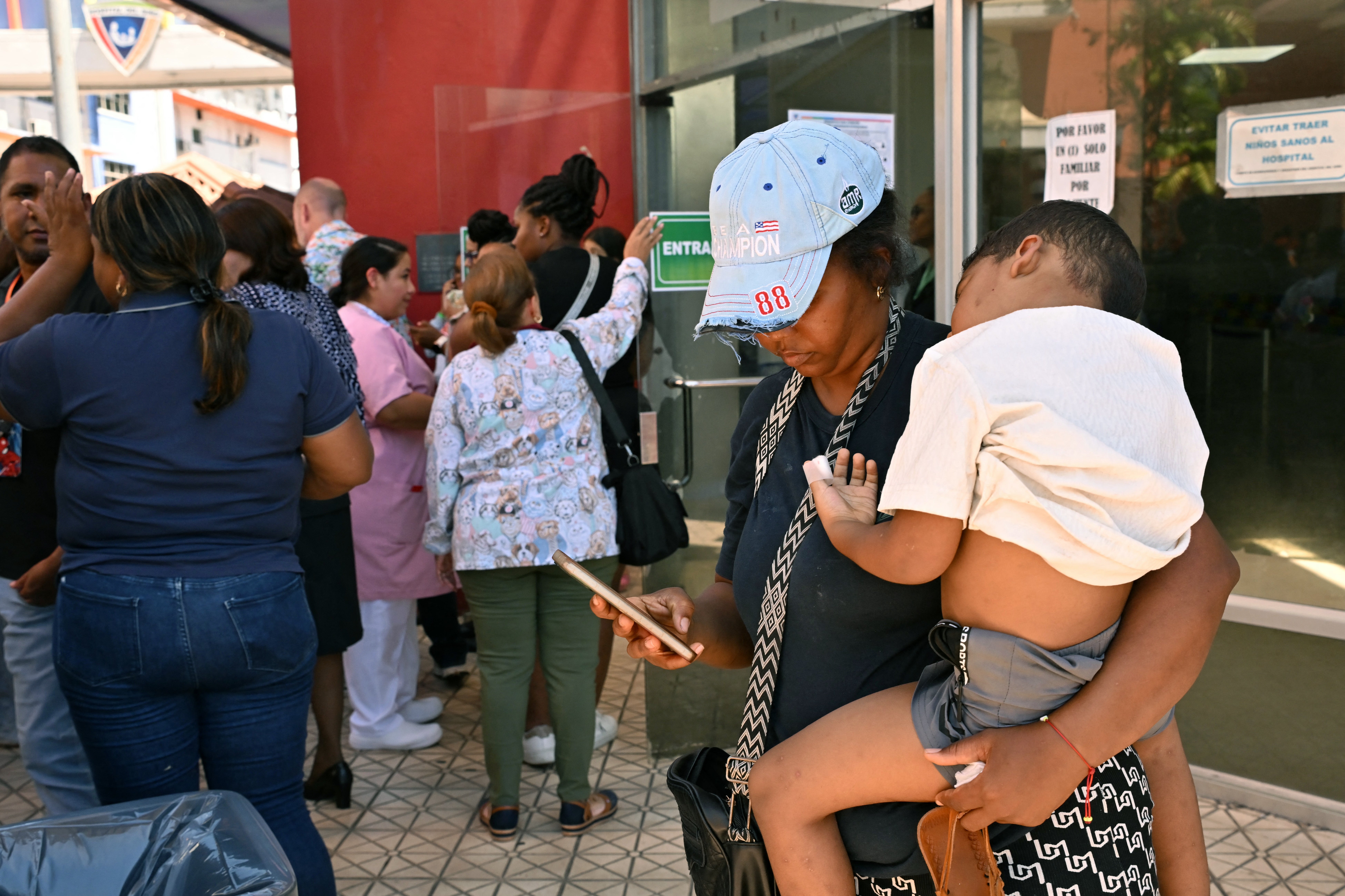 Visibly shaken residents waited in the streets for news of the impact