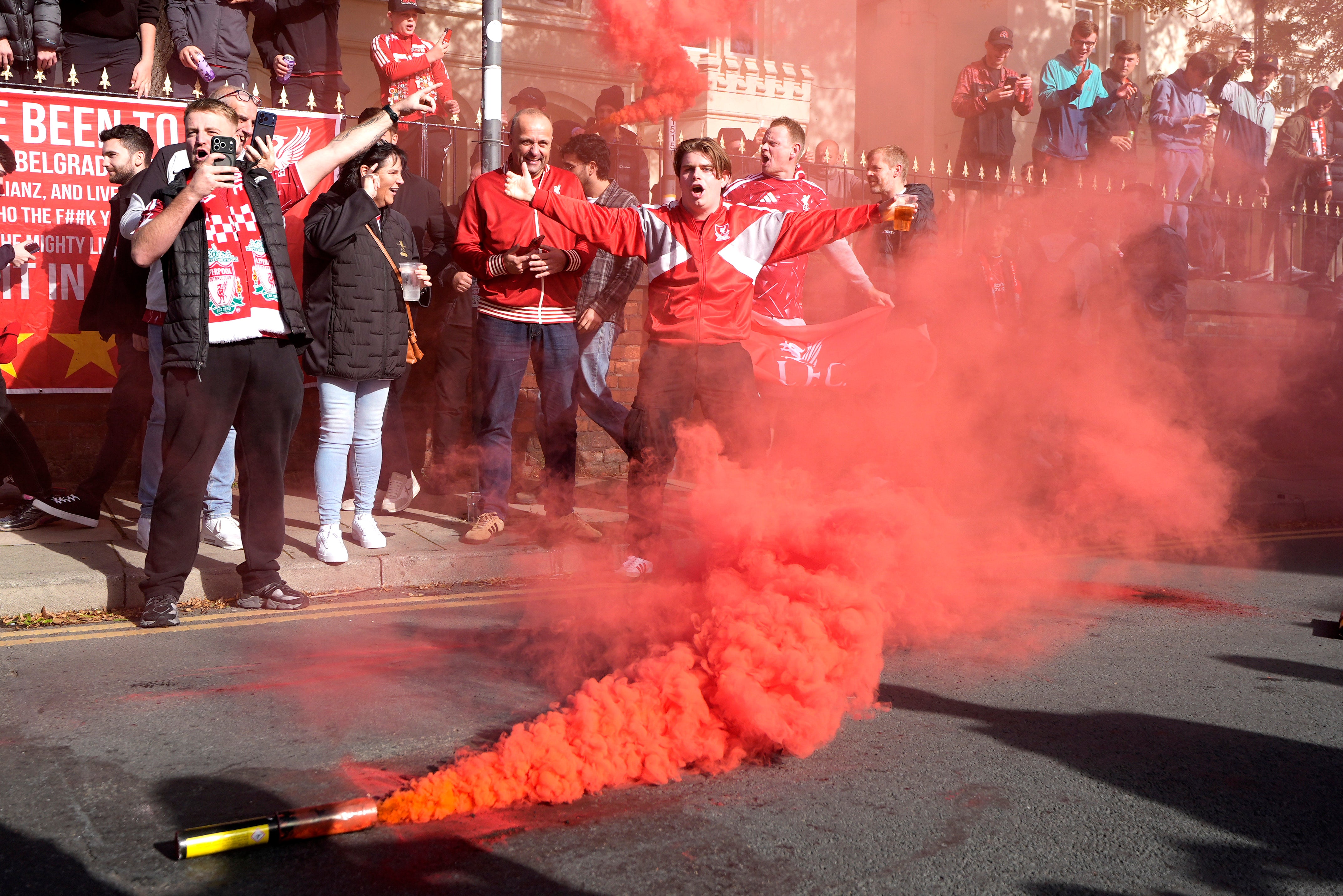 Liverpool fans set off flares as the Manchester City bus arrived at Anfield