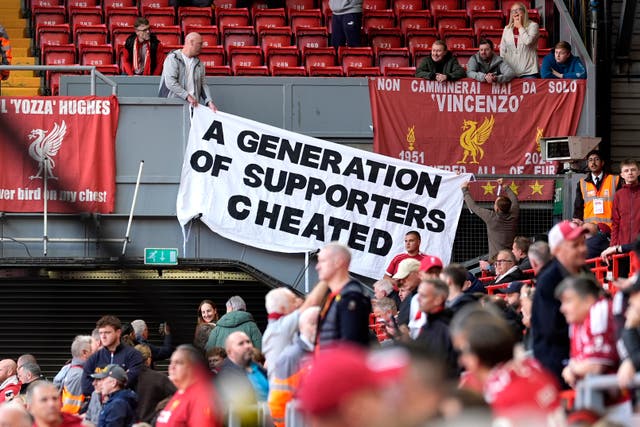 A banner is displayed with the words 'A generation of supporters cheated' by Liverpool fans before their match with Man City