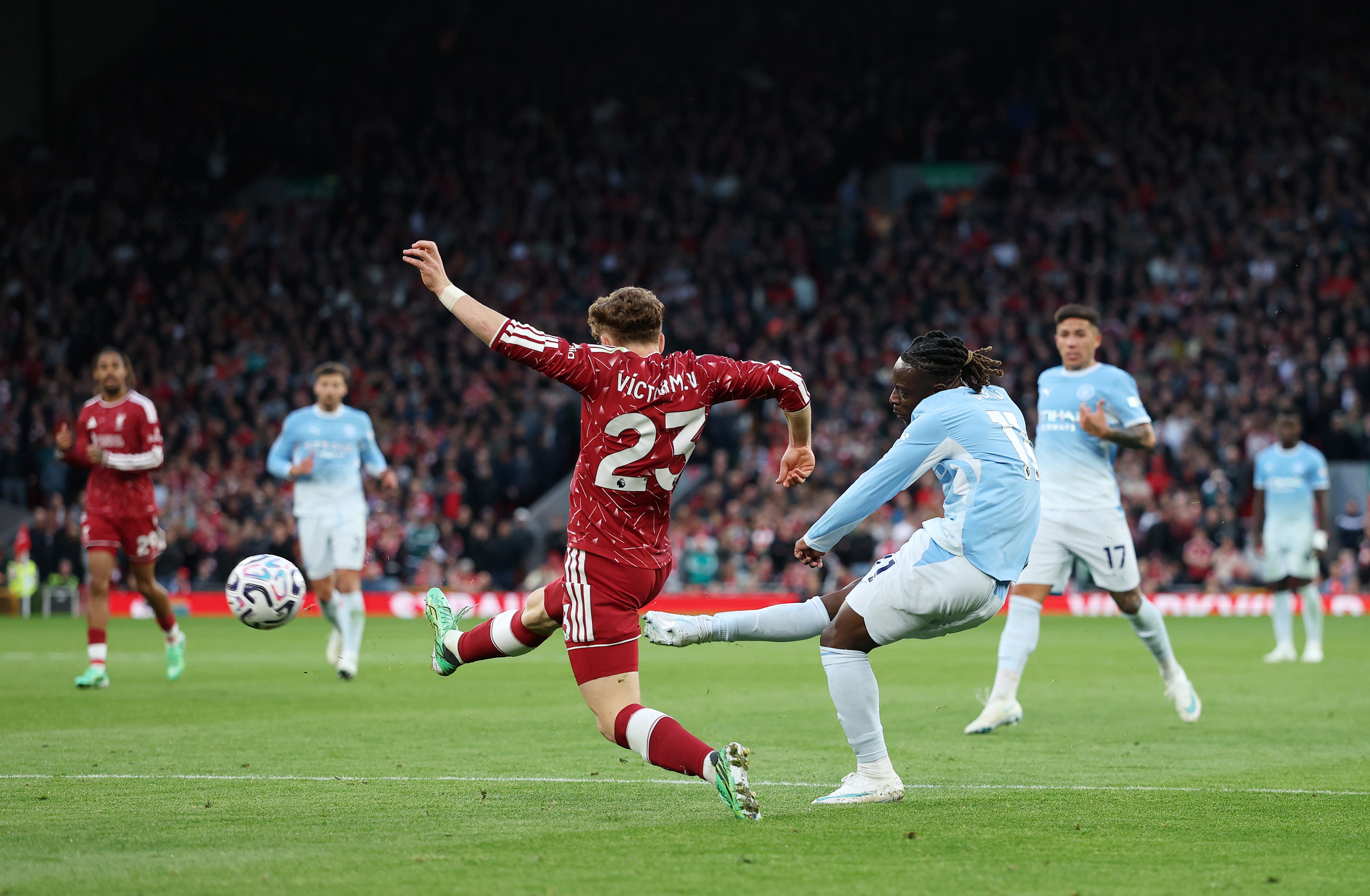 Jeremy Doku whips in the second goal for City