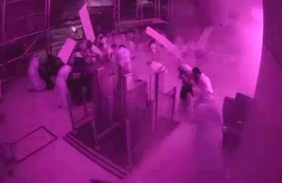 This image from CCTV video released by Saudi Arabia's Media Ministry shows passengers taking cover as flames and smoke fill part of King Khalid International Airport in Riyadh, Saudi Arabia, during what authorities described as a strike at the airport on Saturday, 10 Oct 2026