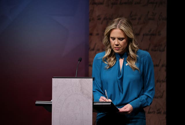 Democrat Annie Andrews takes notes before Sunday’s debate with Graham