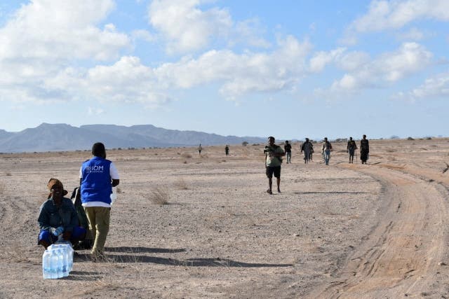 International Organization for Migration workers receive migrants after a boat carrying about 305 people capsized while sailing from Djibouti to Yemen.