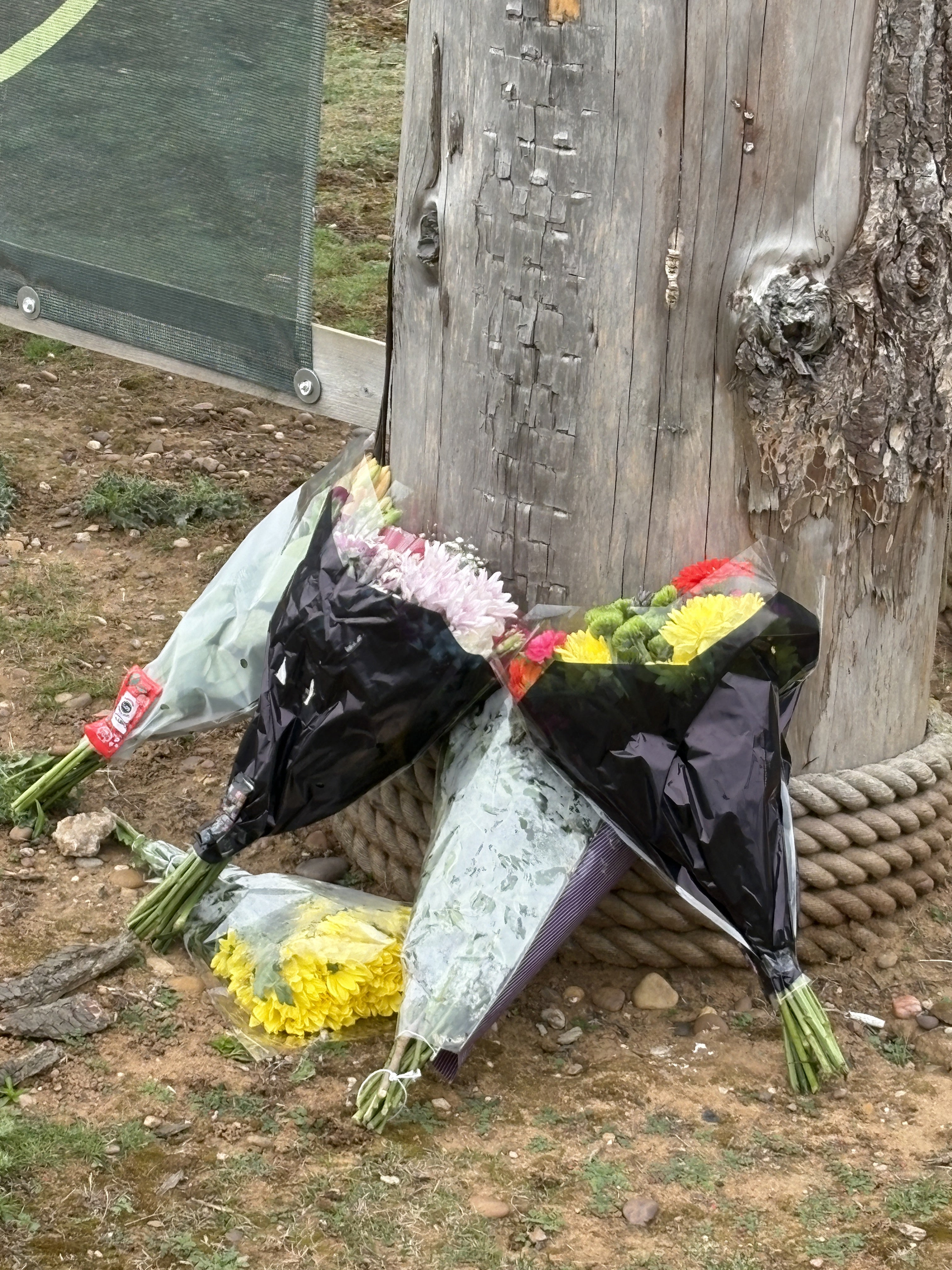 Flowers left at the entrance of Yorkshire Wildlife Park in Doncaster, where a man died after suffering serious injuries in a tiger enclosure (Dave Higgens/PA)