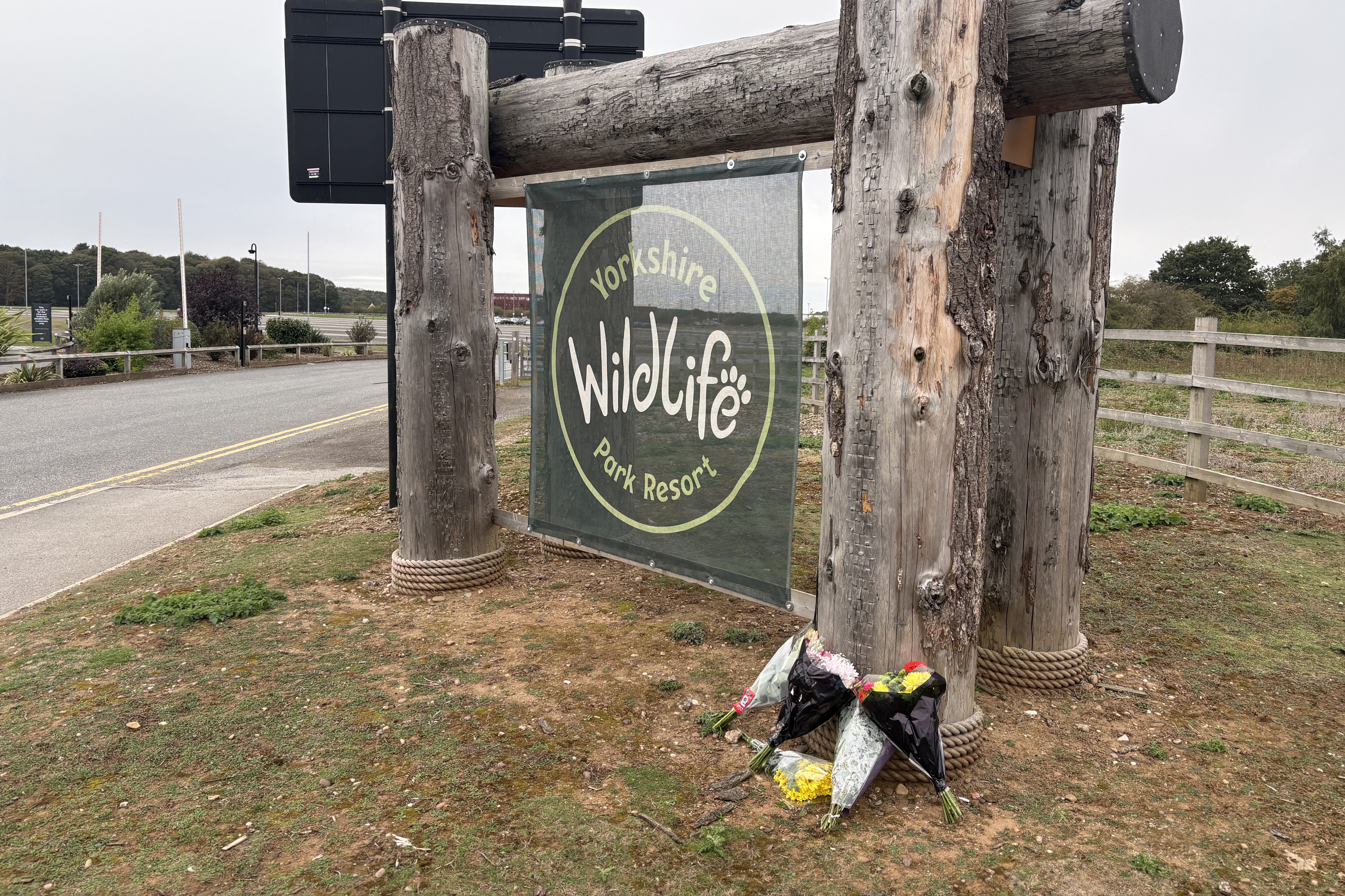 Flowers left at the entrance of Yorkshire Wildlife Park in Doncaster, where a man died after suffering serious injuries in a tiger enclosure at the wildlife park (Dave Higgens/PA)