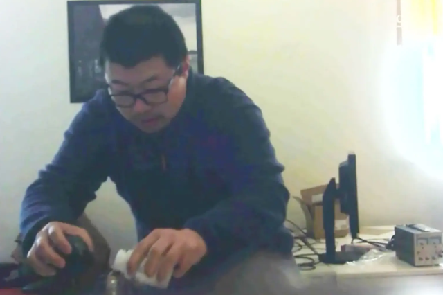 David Xu pours cadmium into water bottle of Rong Yuan