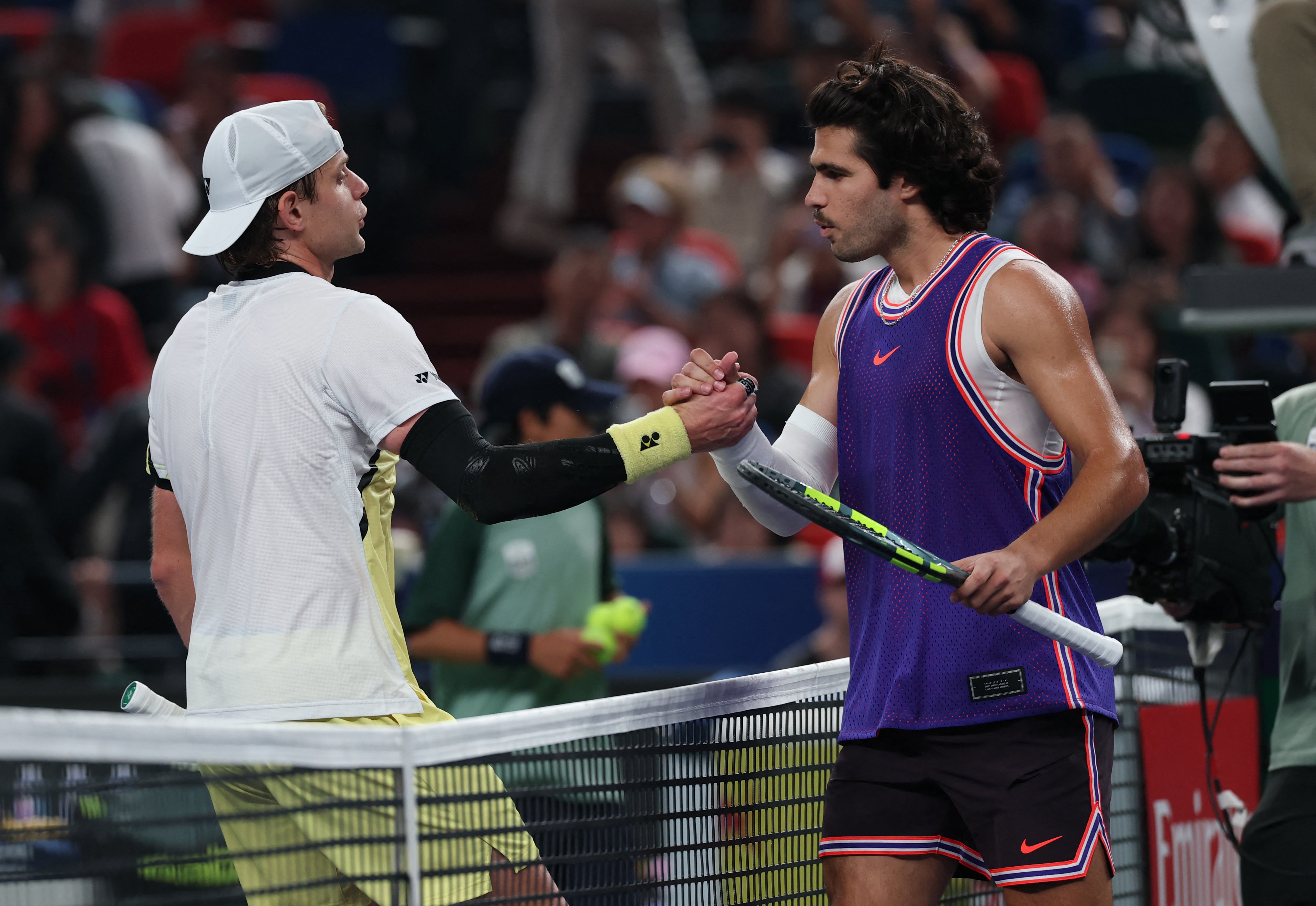 Carlos Alcaraz (right) lost to Zizou Bergs