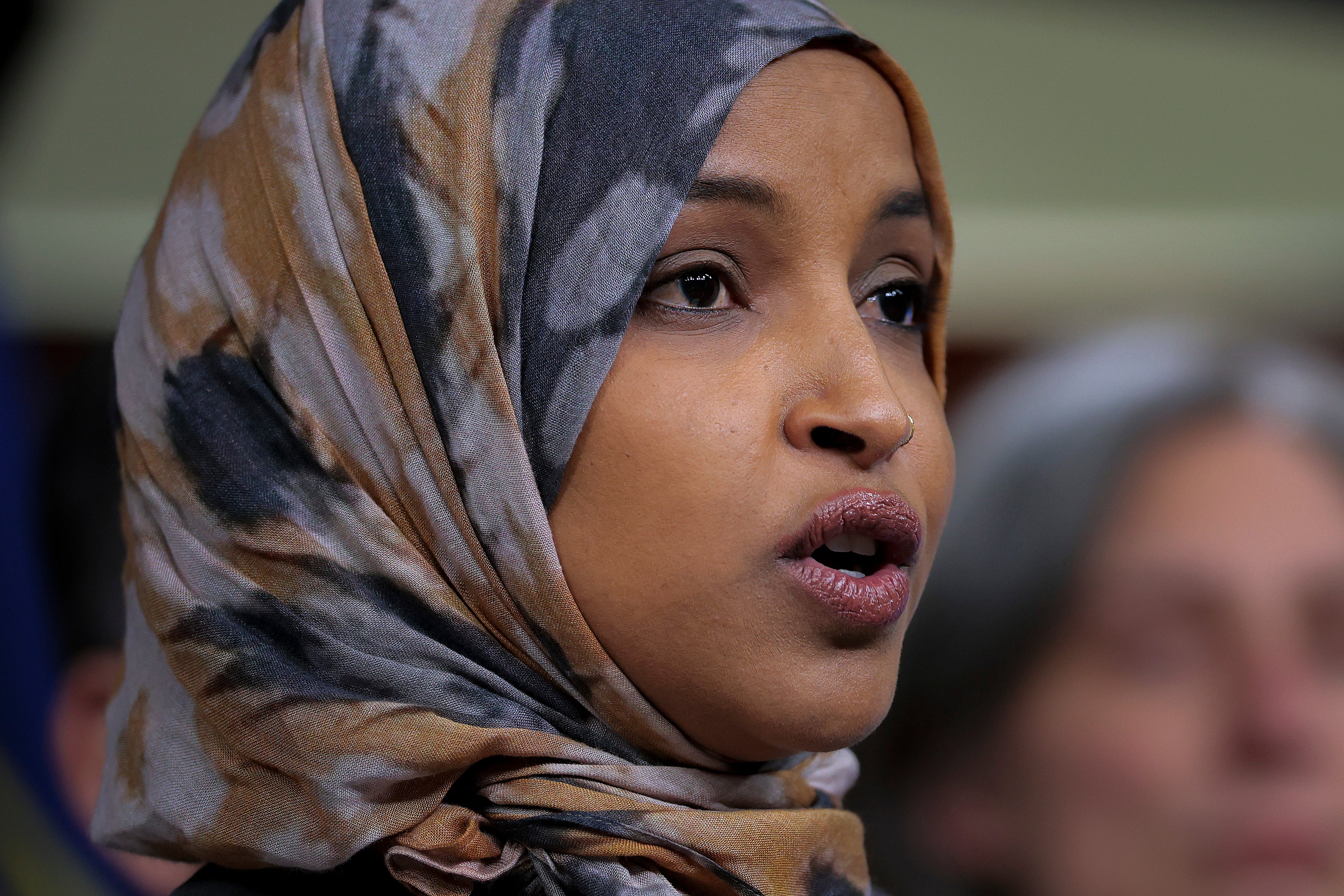 Ilhan Omar breaks silence on home raid with five-word message for Trump ...