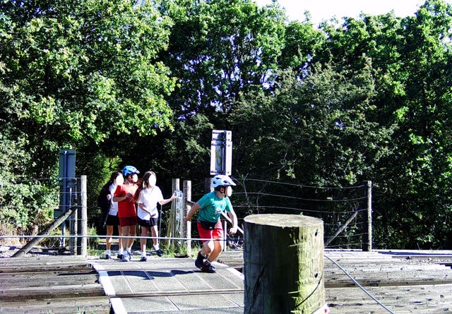 Young children were seen on camera playing games on the railway lines