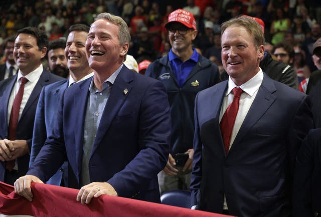 Jon Gruden, a former NFL and Super Bowl-winning coach, introduced the president at Monday’s rally and mentioned to Trump that he and Husted played together in college