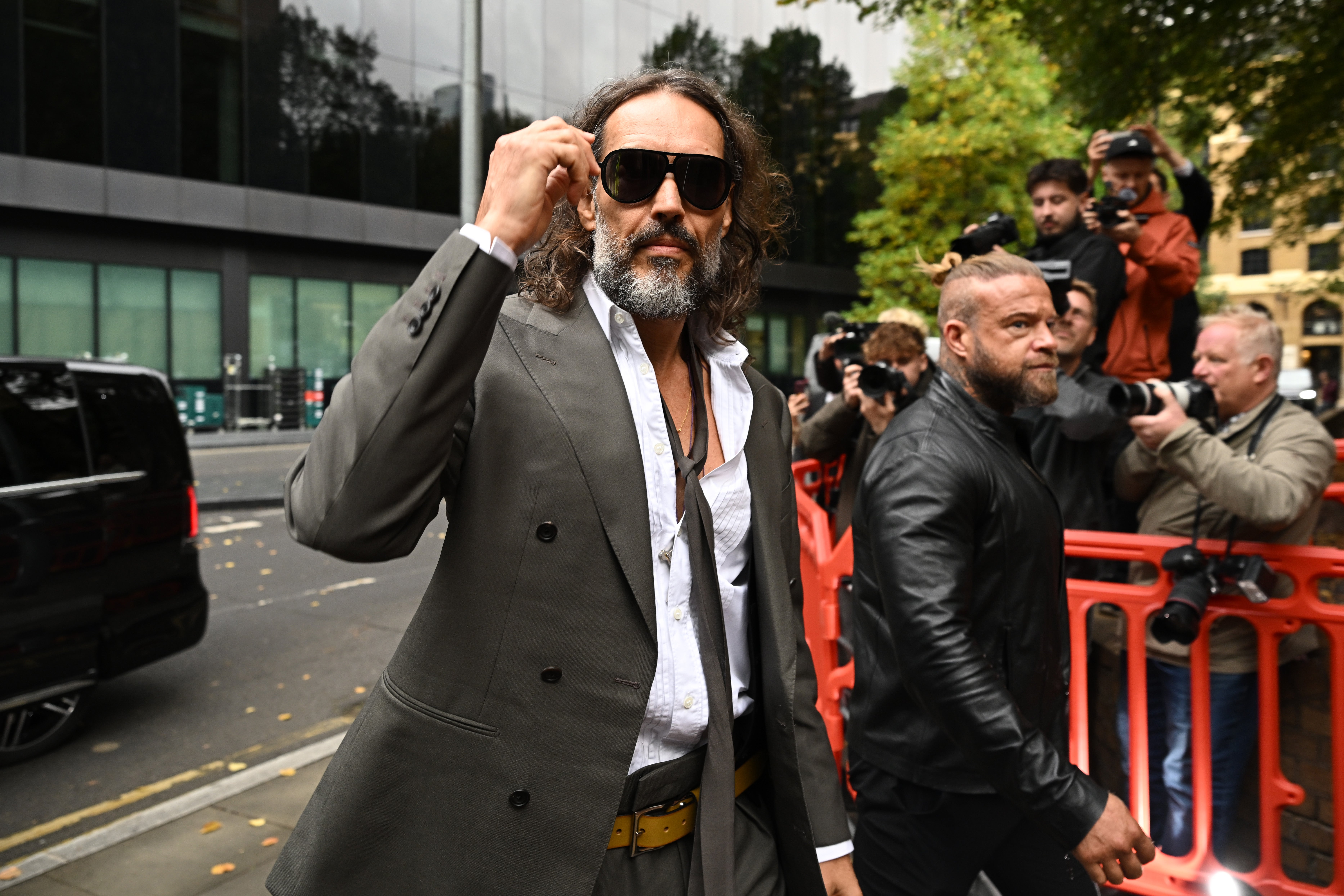 Russell Brand tells crowd he is ‘blessed’ outside court as actor faces rape charges