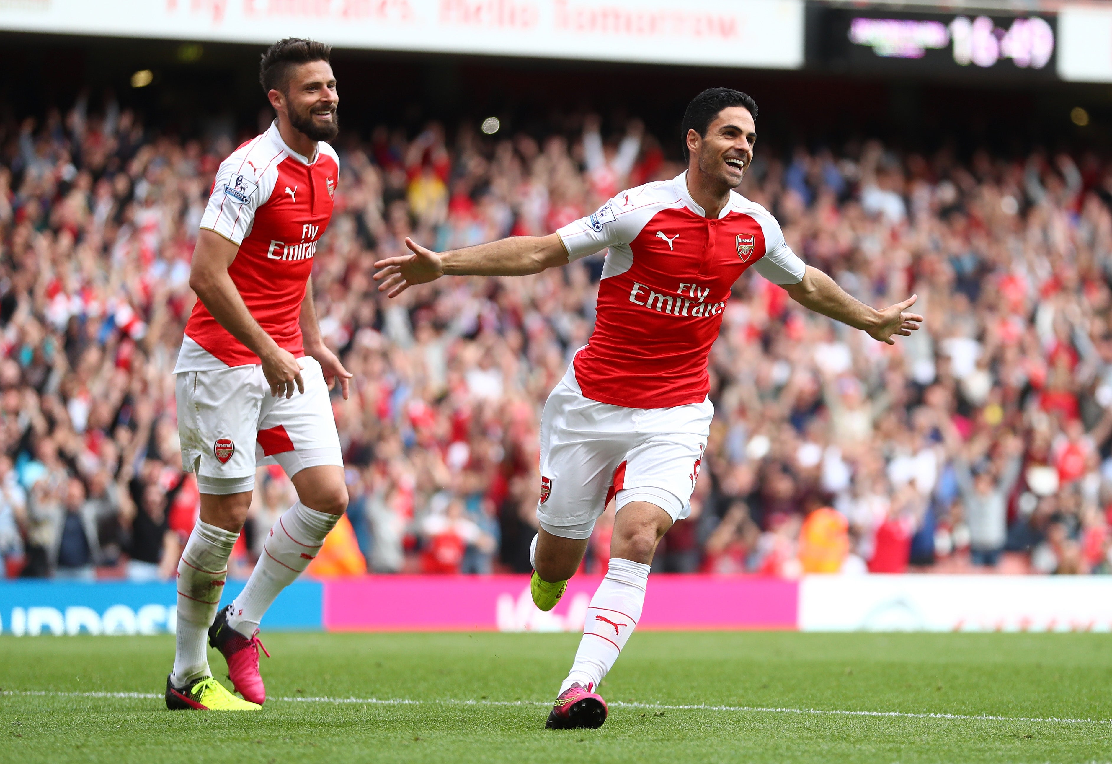 Mikel Arteta (right) celebrates with Olivier Giroud