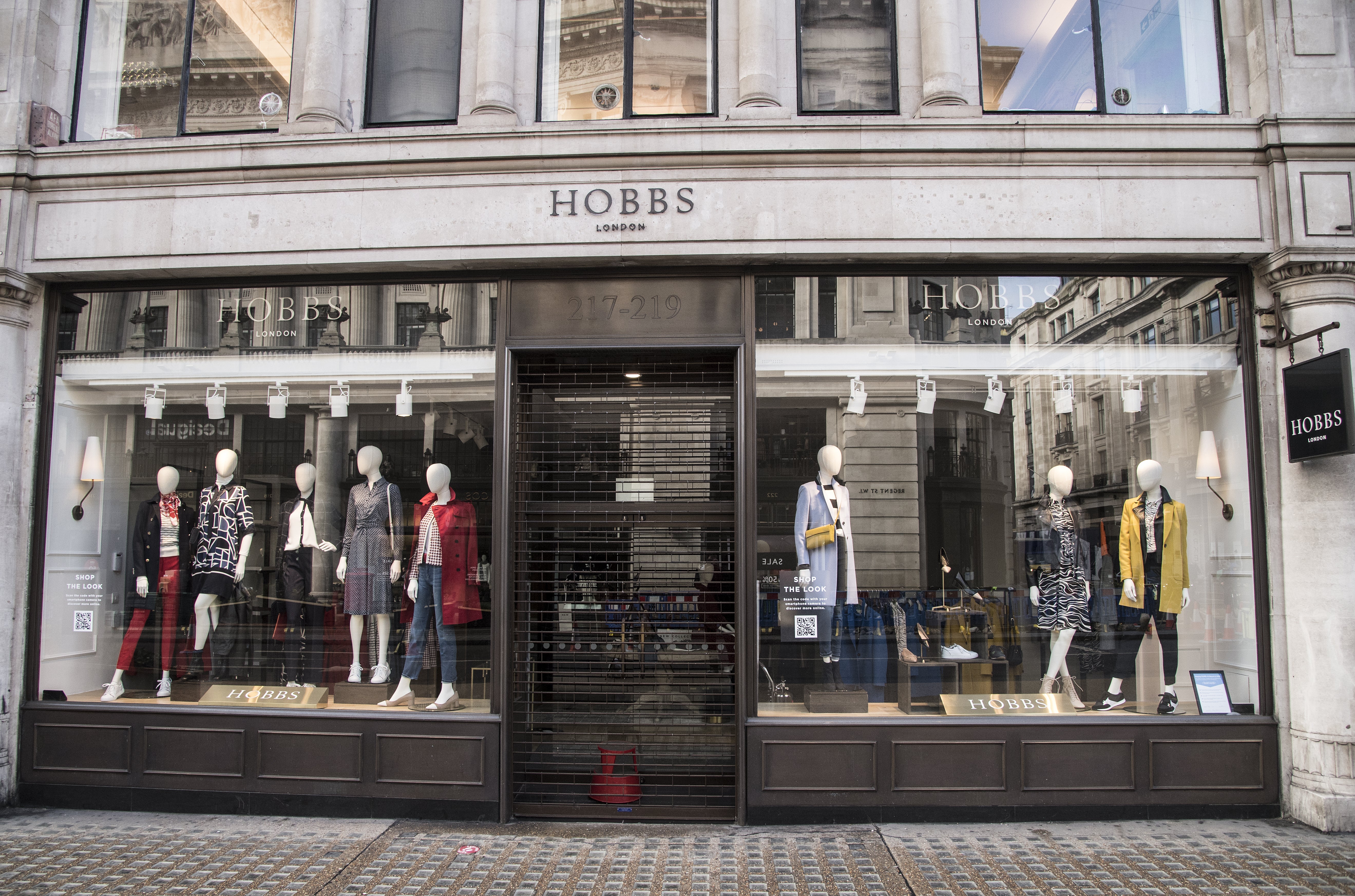 The owner behind womenswear brands Hobbs and Whistles apologised to customers on Tuesday after being hit by a cyber attack.