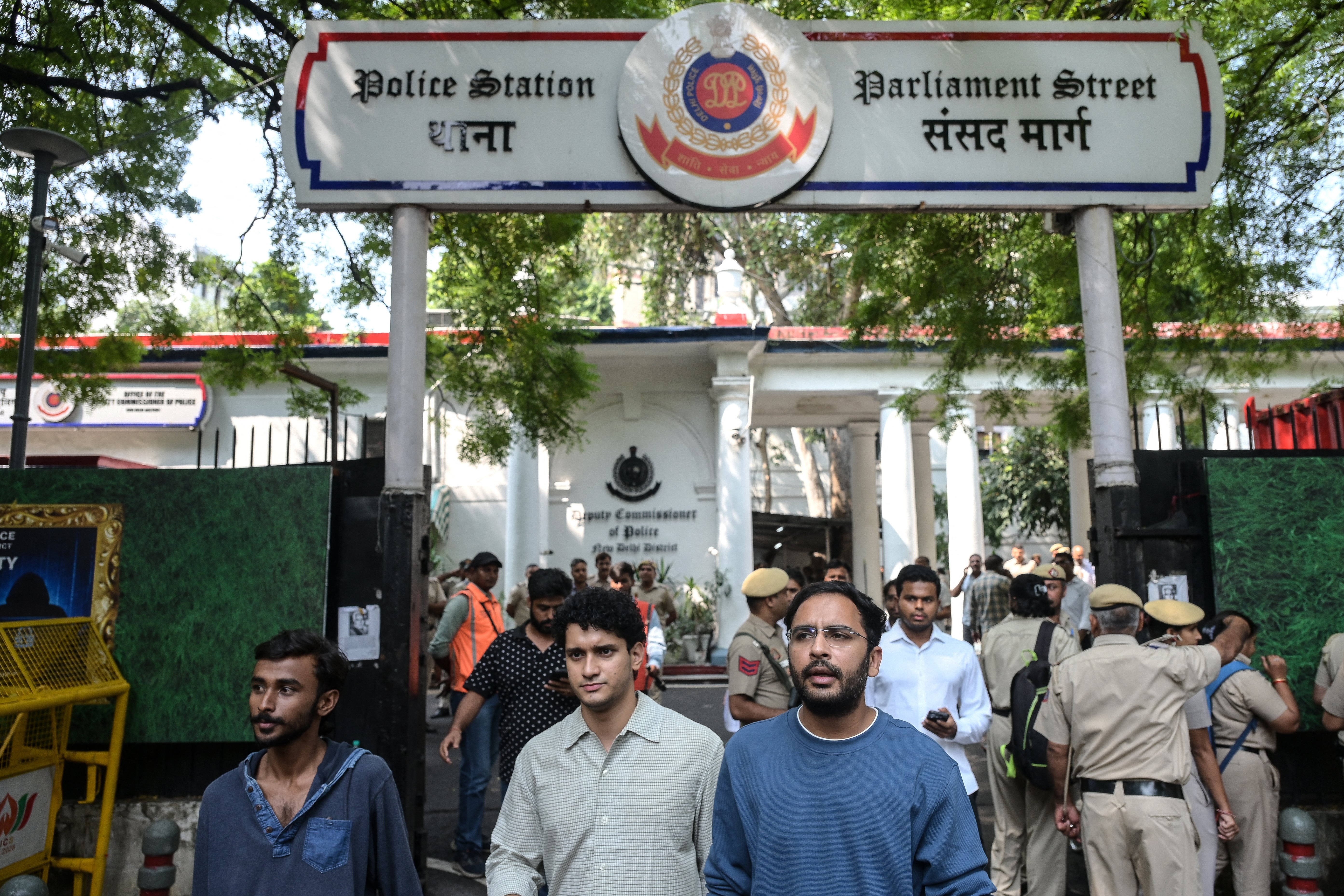 Cockroach Janta Party spokespersons Saurav Das and Ashutosh Ranka walk out of a police station as they seek approval for a protest demanding the resignation of chief election commissioner Gyanesh Kumar (AFP/Getty)