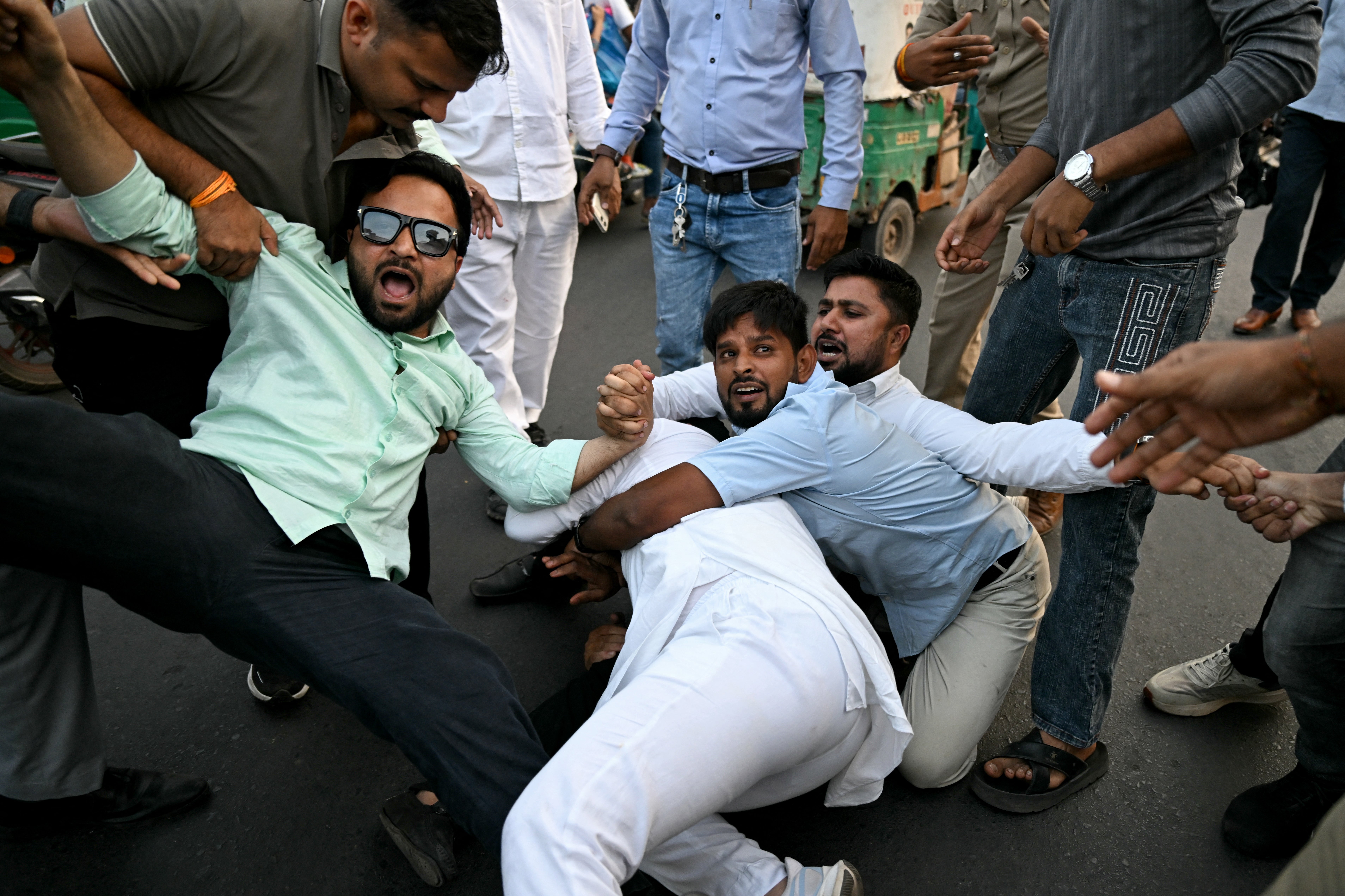 Police detain protesters during a demonstration chief election commissioner Gyanesh Kumar’s resignation (AFP/Getty)