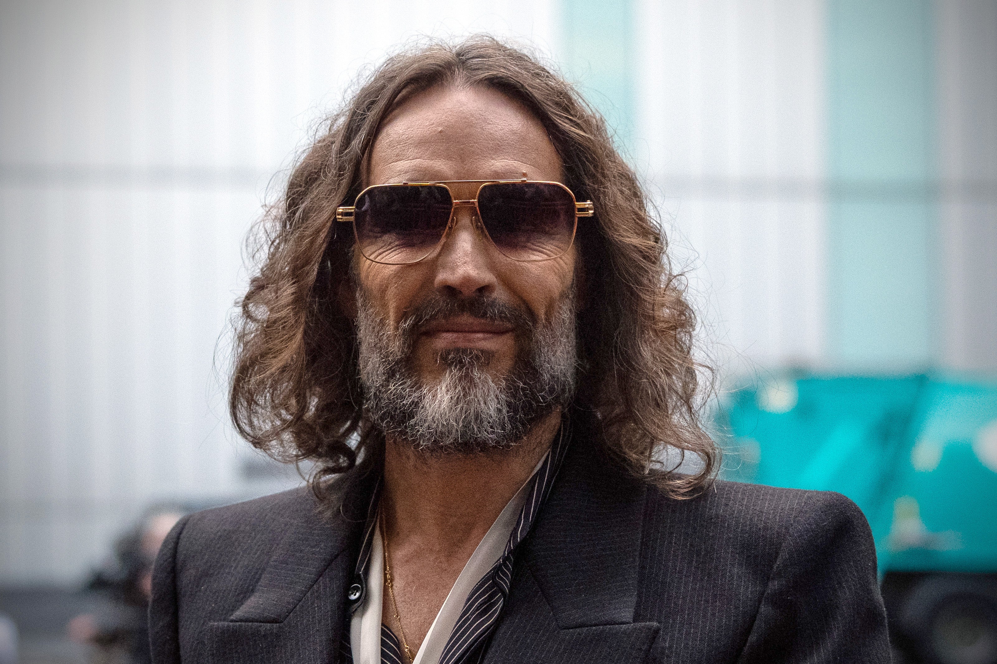 Russell Brand pictured outside court on Wednesday (Getty)