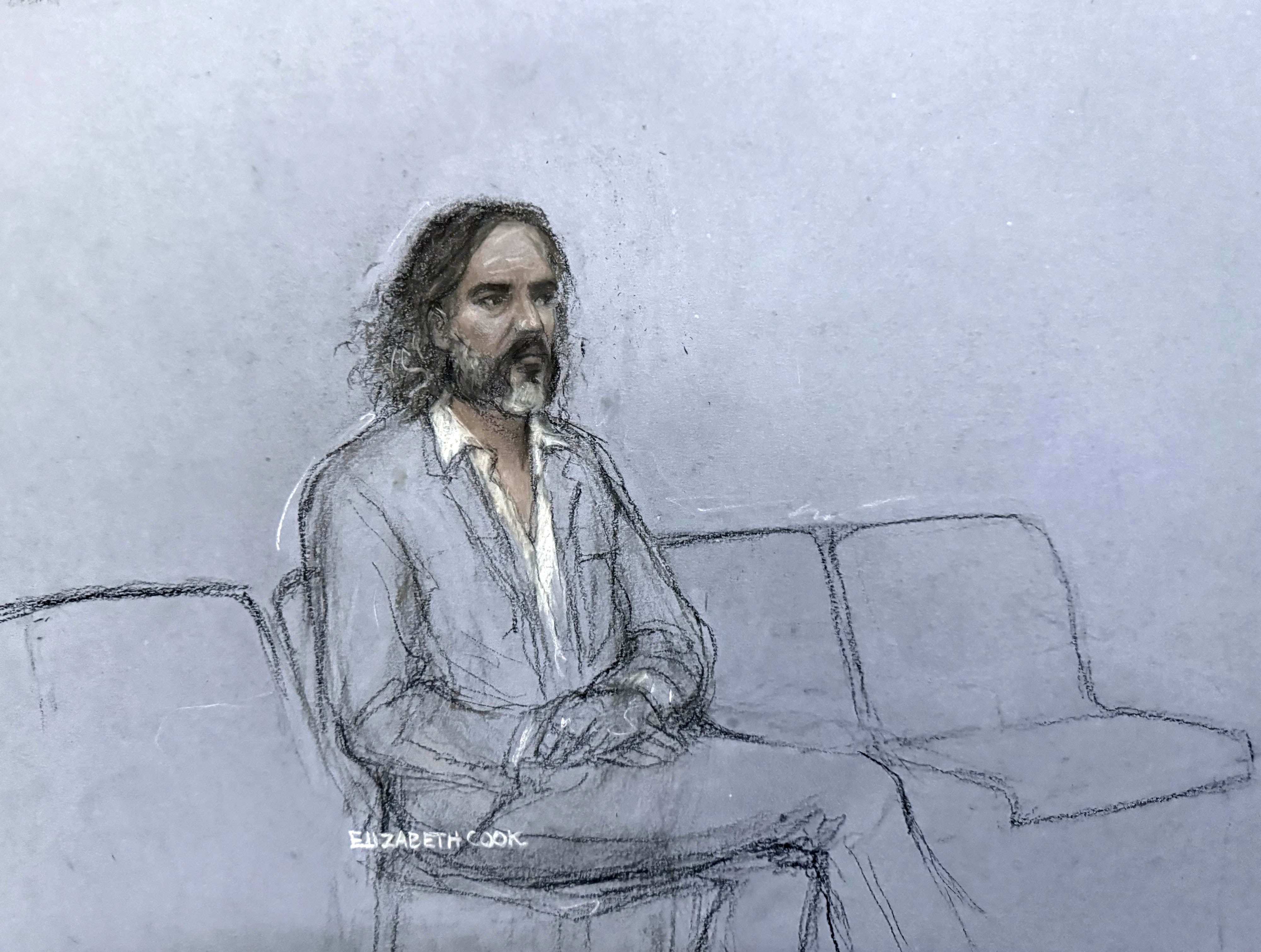 Brand listening to the prosecutor’s opening address in court
