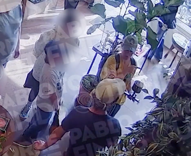 Store security footage shows Kelly Clarkson pointing at the bird and asking the Art of Play shopkeeper about buying it