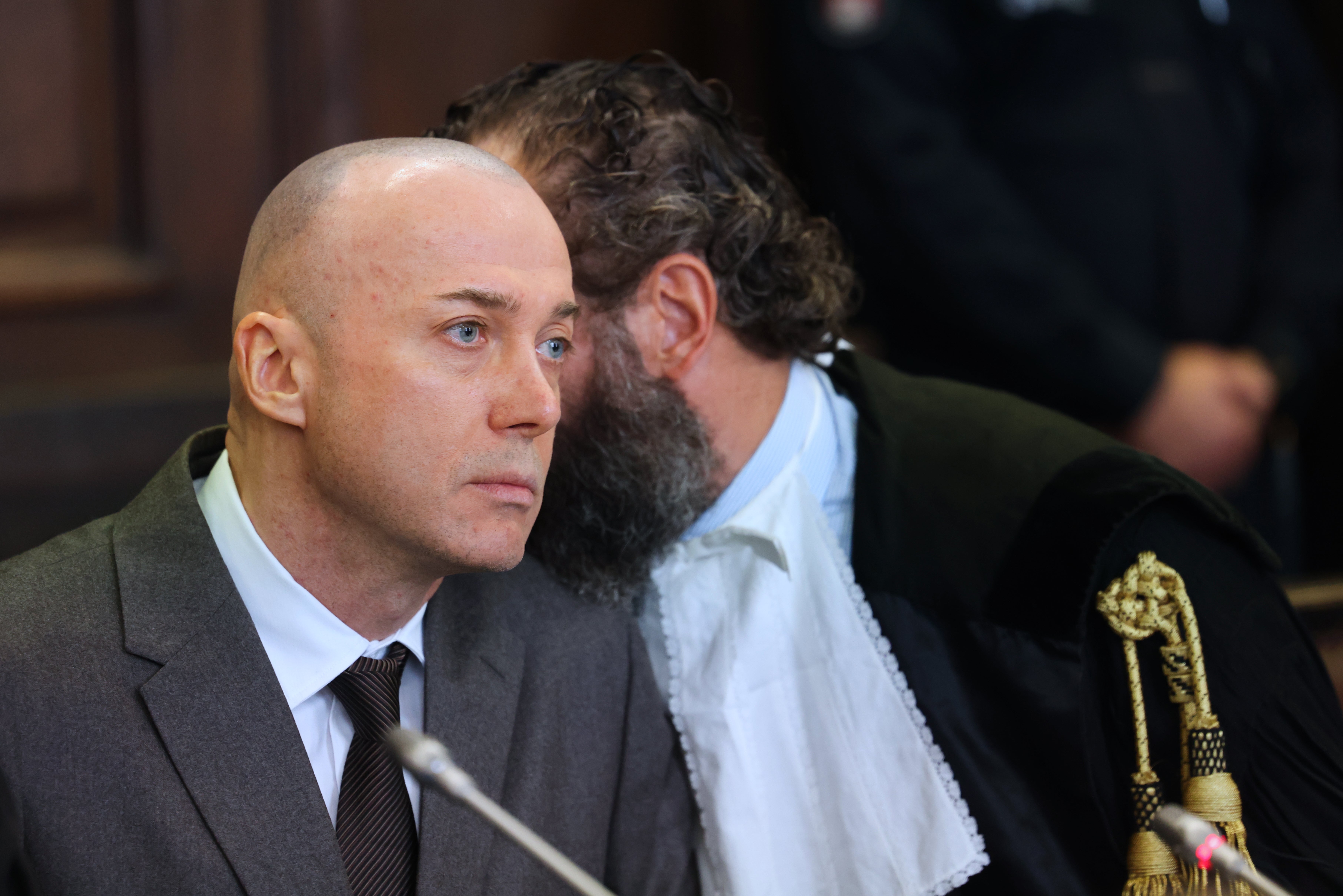 Serhii Kuznetsov, left, attends the first day of the trial in connection with the 2022 bombings of the twin Nord Stream pipelines