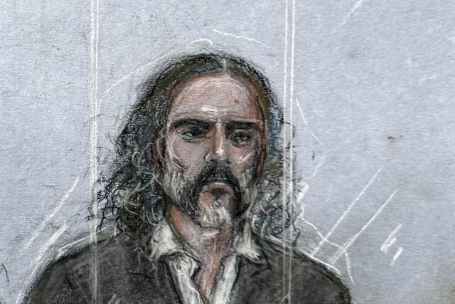 Russell Brand appearing in the dock at Southwark Crown Court at the start of his trial