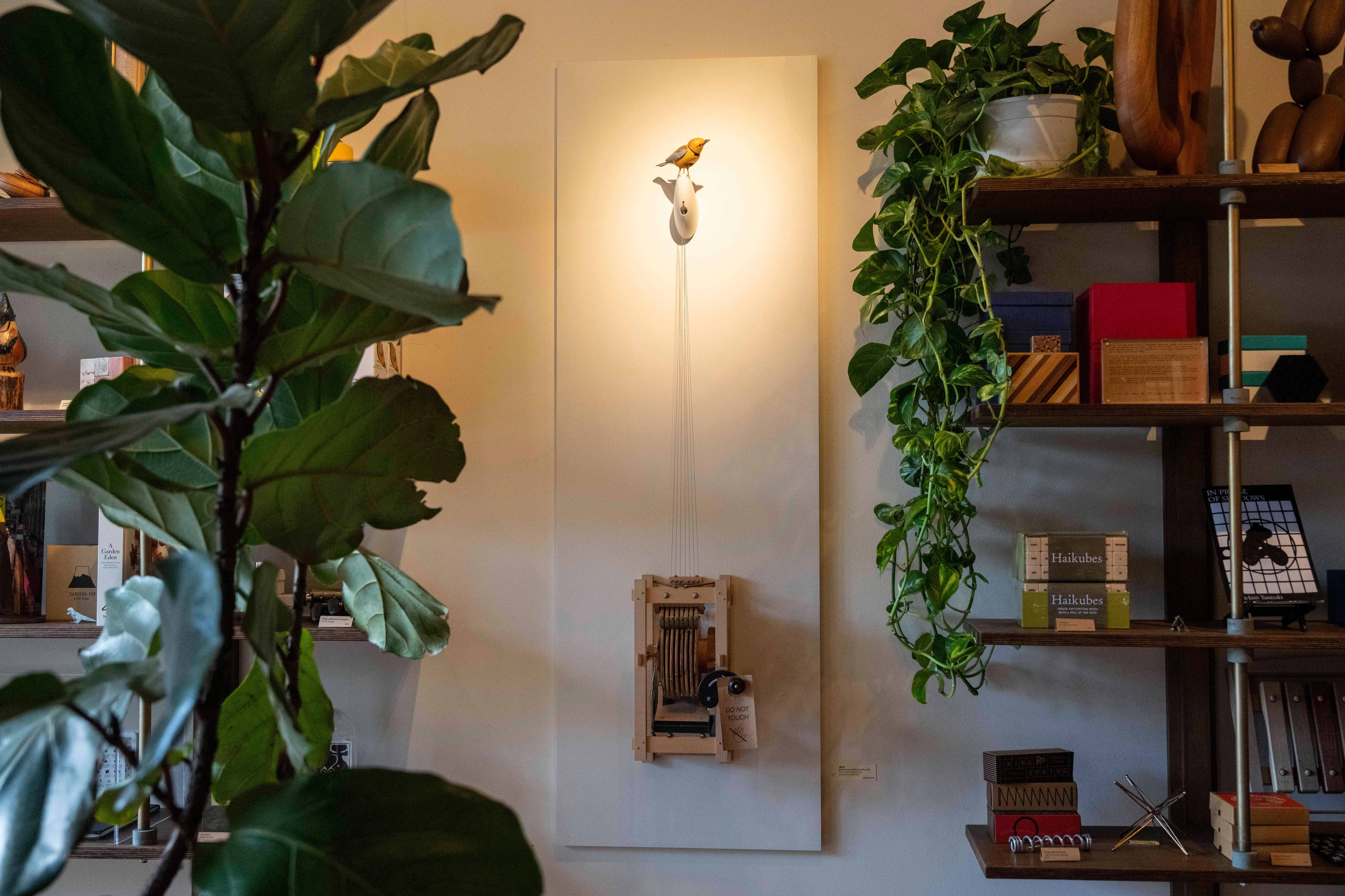 Molly, a singing and dancing mechanical bird made by artist Bliss Kolb, is on display at Brooklyn store Art of Play