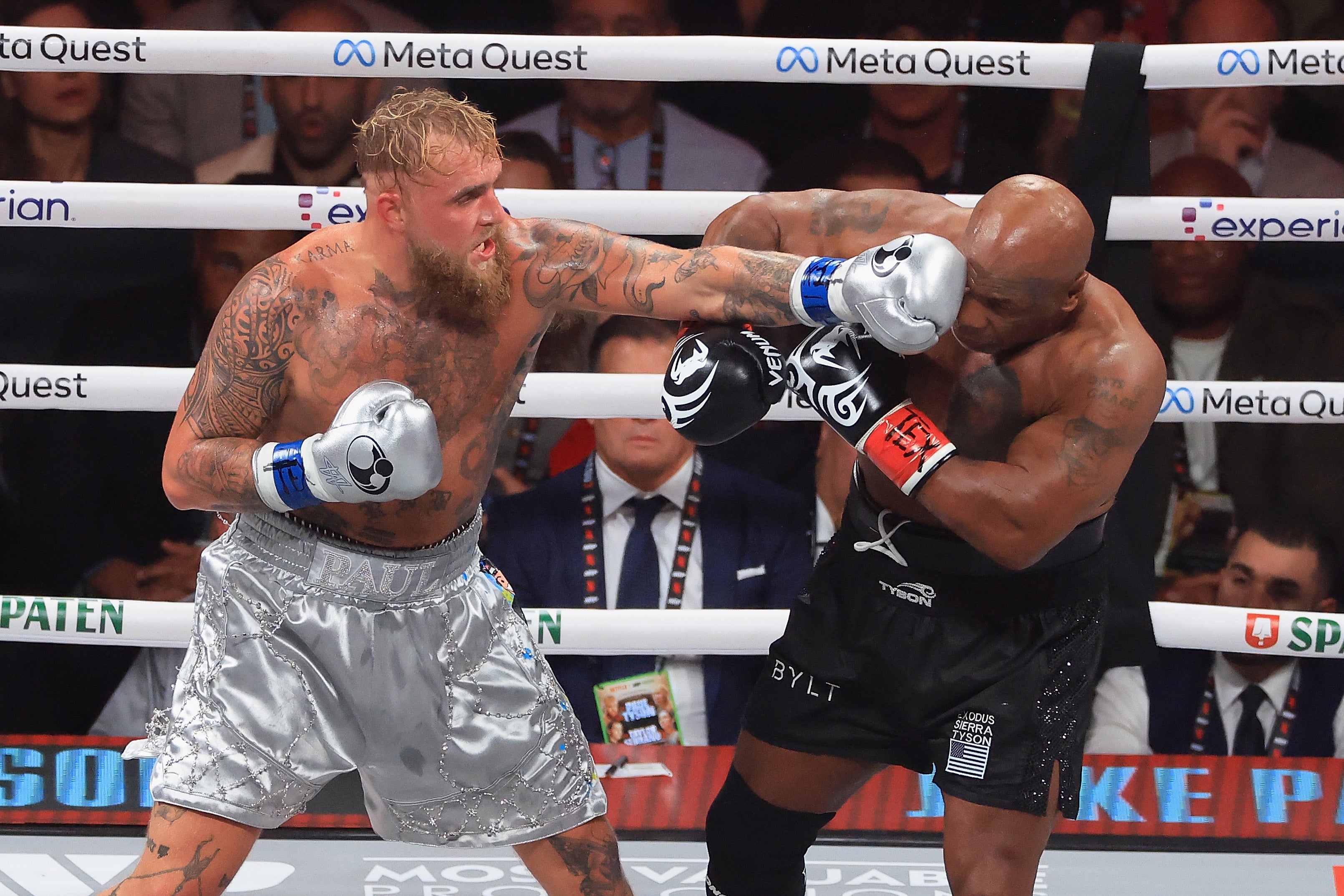 Jake Paul throws a left on Mike Tyson during a bout in Texas in 2024