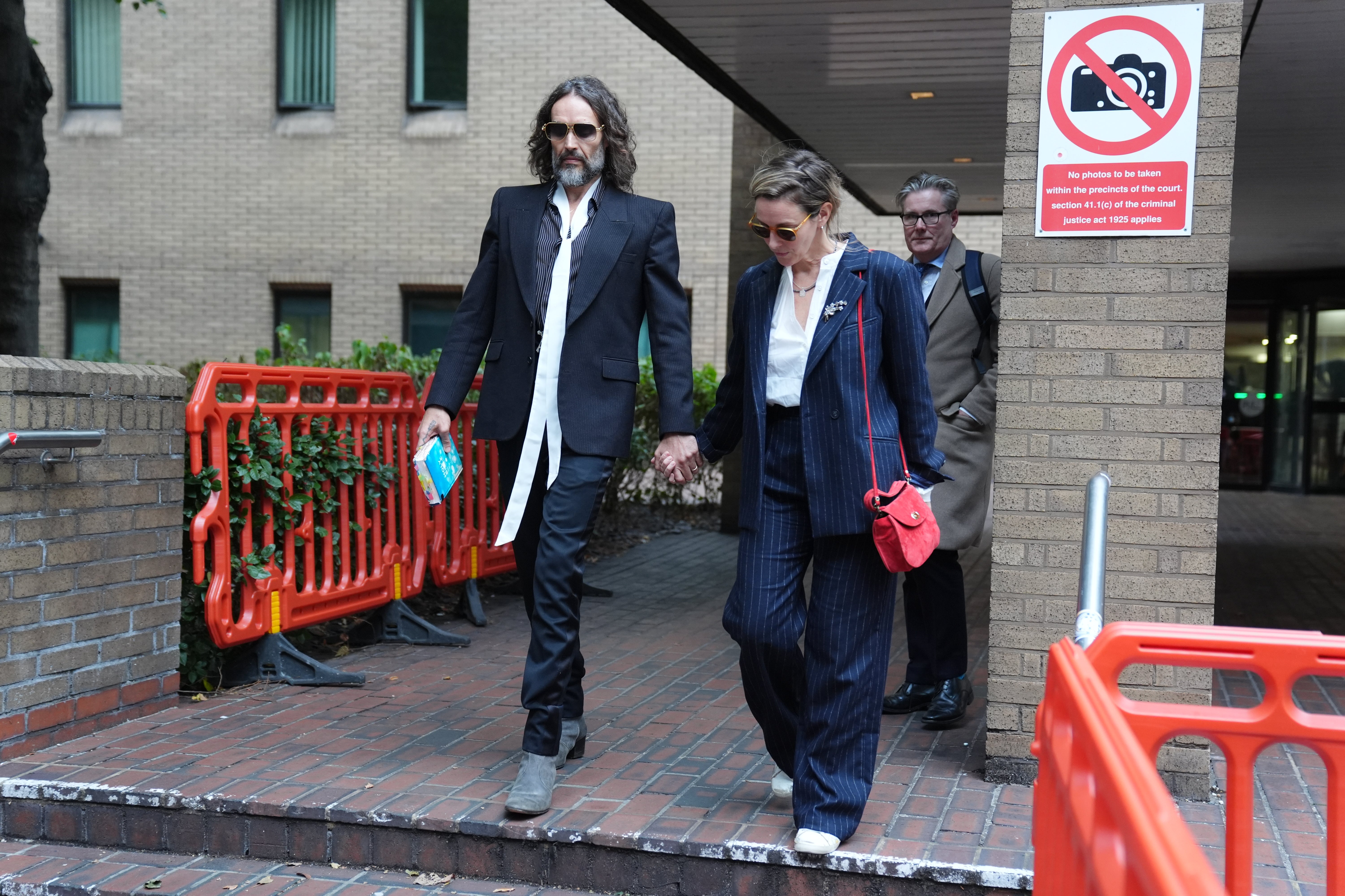 Russell Brand leaving Southwark Crown Court with his wife, Laura Gallacher