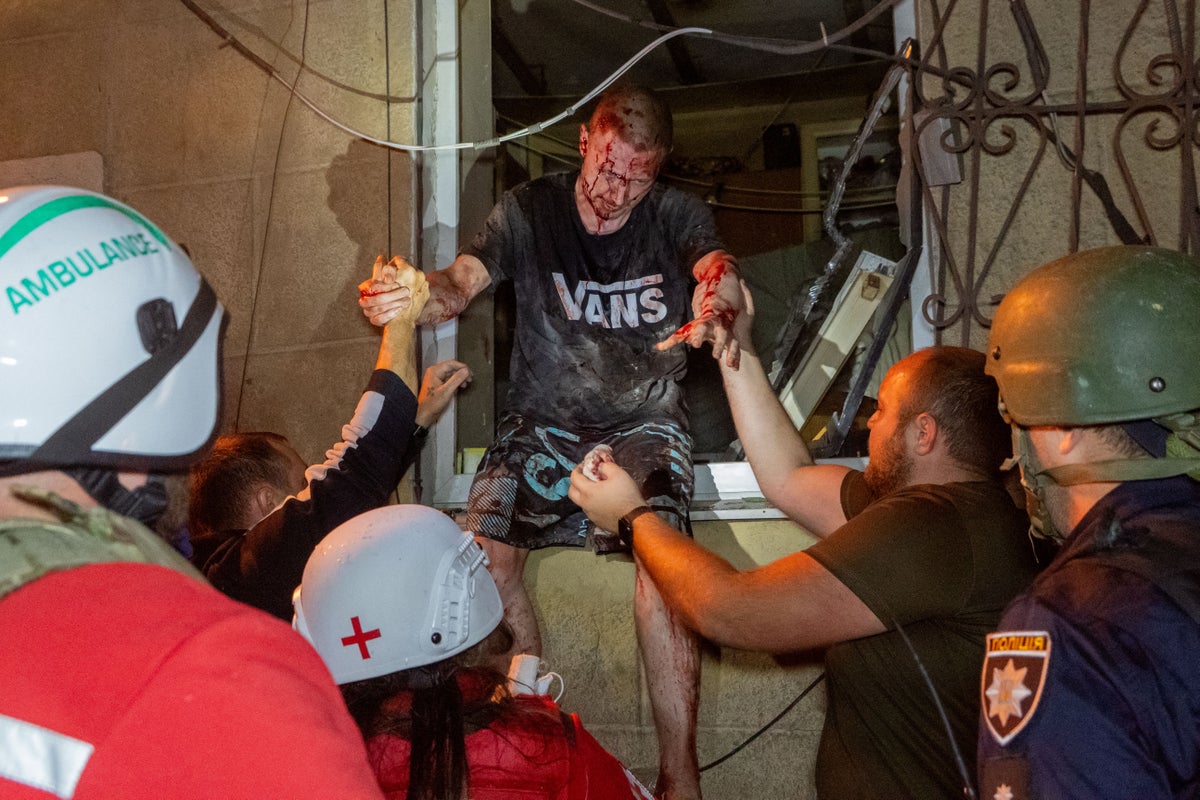 Photos of Ukrainian residents escaping their burning homes after deadly Russian attacks