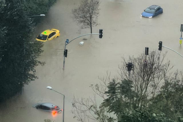 Vehicles are stranded in a partially flooded highway during heavy rains in Istanbul, Turkey, Wednesday, Oct. 14, 2026. (AP Photo/Egecan Ozguner)
