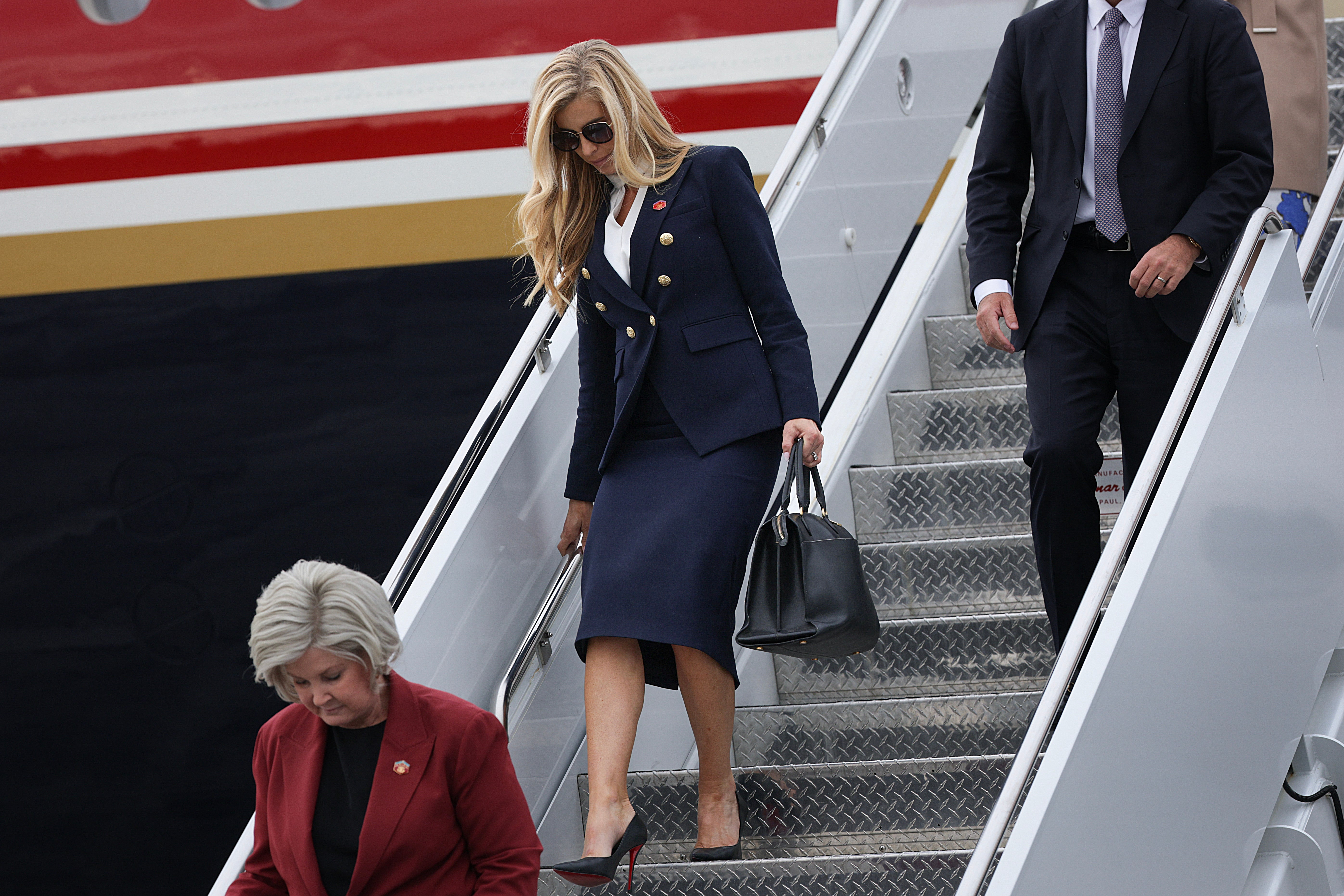 ELMDORF AIR FORCE BASE, ALASKA - OCTOBER 13: White House Press Secretary Katie Zacharia arrives with U.S. President Donald Trump on October 13, 2026 at Elmendorf Air Force Base, Alaska. President Trump is traveling to Alaska to headline a rally for incumbent Sen. Dan Sullivan (R-AK), who will be facing off against Alaska Democratic Senate candidate, former Rep. Mary Peltola in the midterm elections. (Photo by Alex Wong/Getty Images)