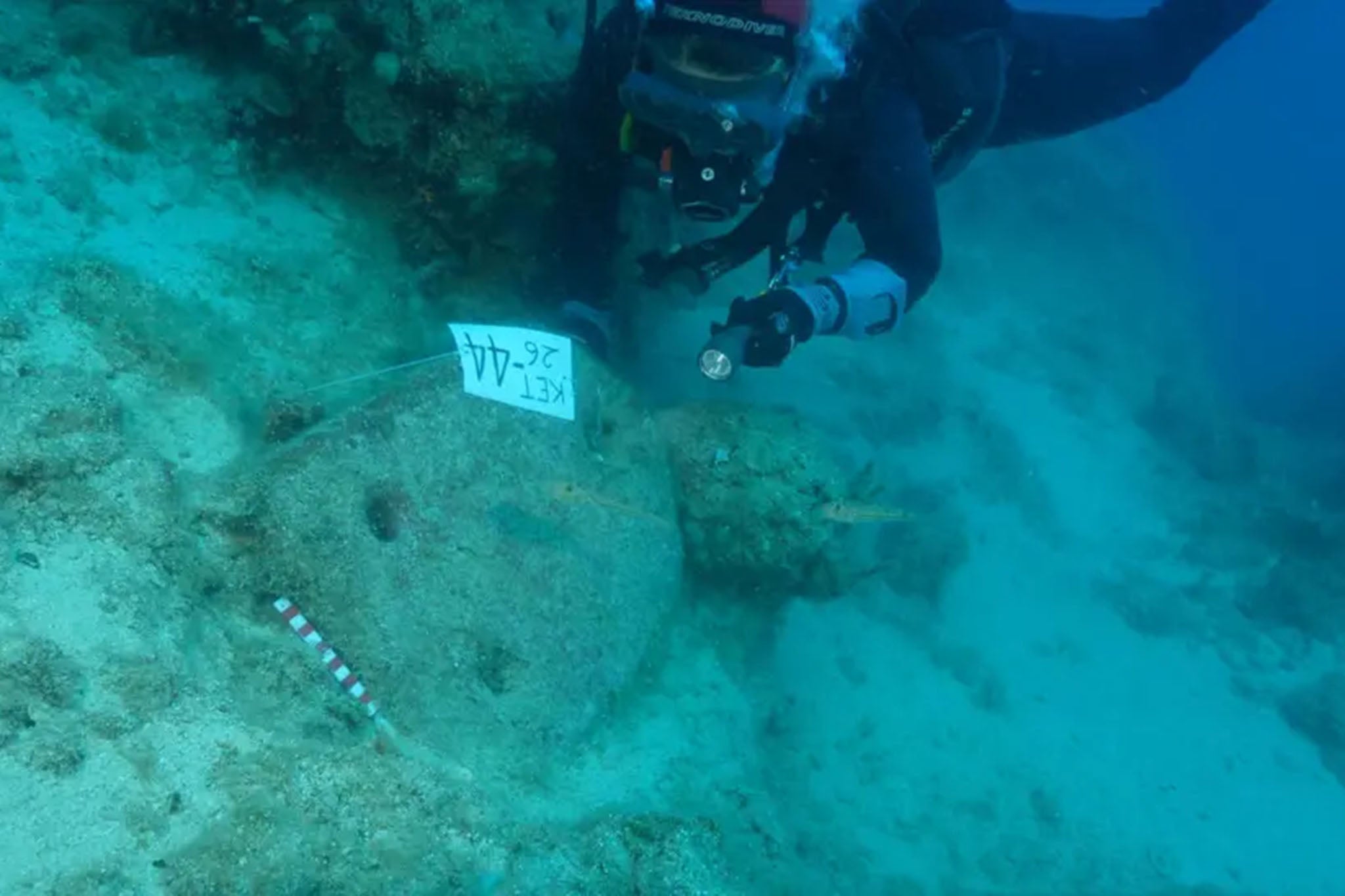 Diver excavates artefacts