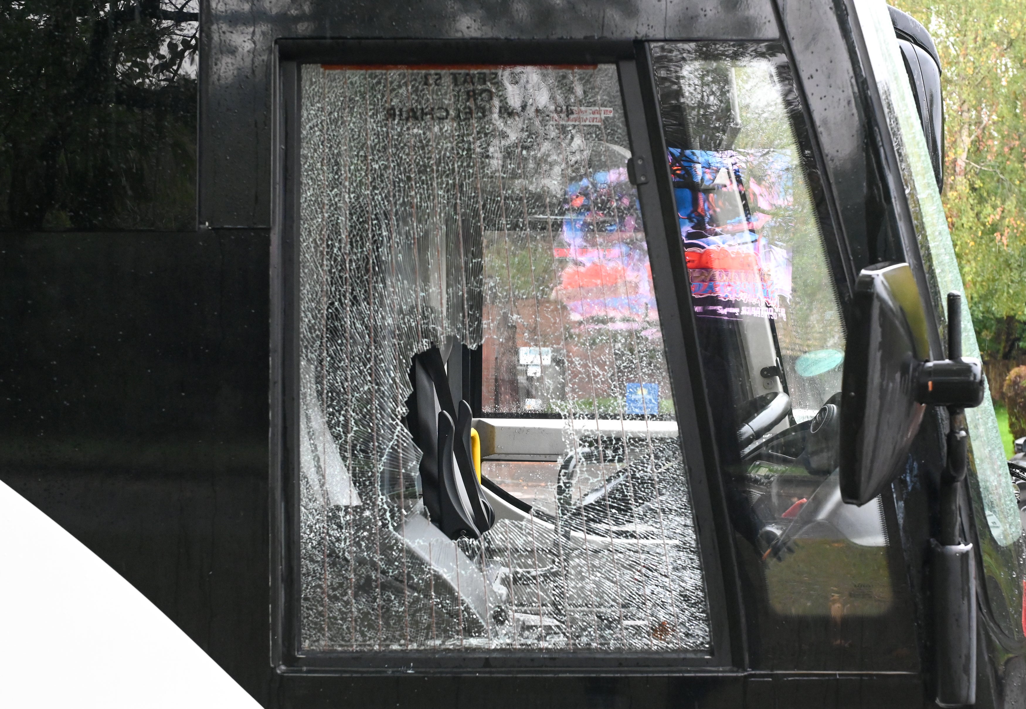 Twelve people were arrested on suspicion of offences including assaulting a police officer, criminal damage and racially aggravated public order offences.