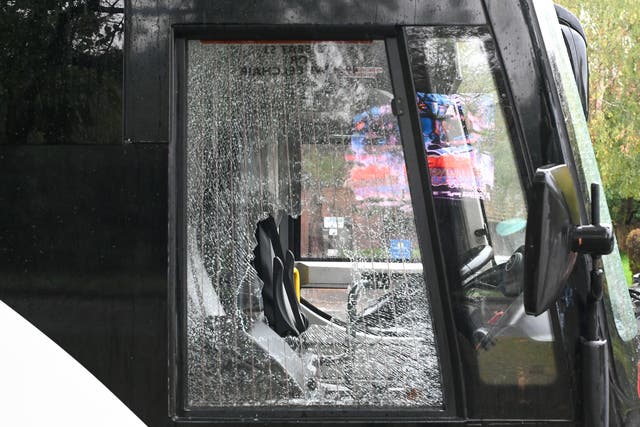 Twelve people were arrested on suspicion of offences including assaulting a police officer, criminal damage and racially aggravated public order offences.