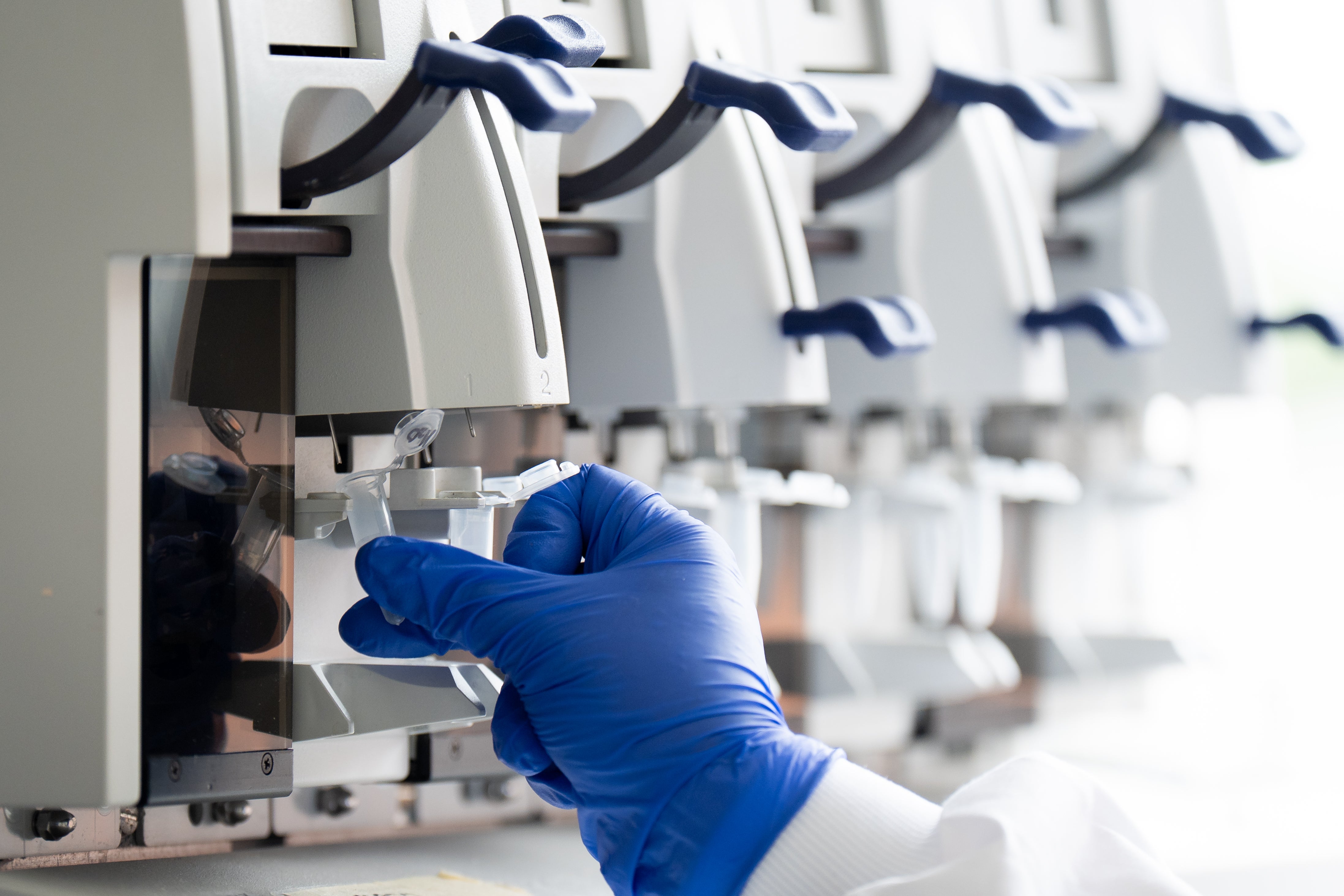 A sample is loaded into the GeneChip Fluidics Station 450Dx (Aaron Chown/PA)