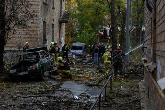 The aftermath of a Russian drone strike in Kyiv on Thursday, as Ukraine said they had been left without US early-warning alerts for incoming ballistic missiles ( Reuters )