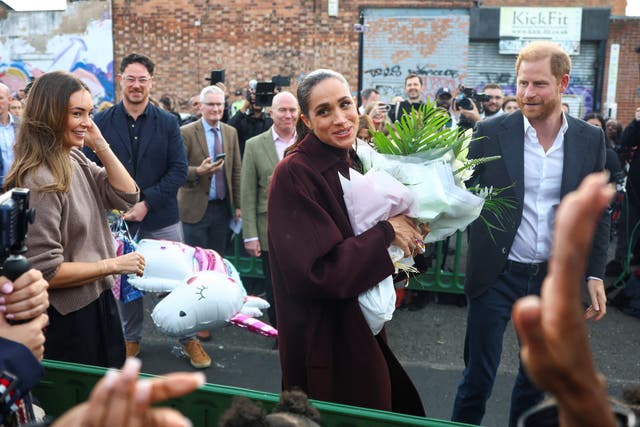 The couple were handed a balloon of a unicorn