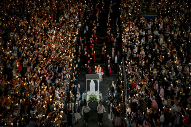 Pope Leo XIV takes part in a torchlight procession following the Rosary Prayer at the Shrine of Our Lady of Lourdes, southwestern France, on September 27, 2026 ( AFP via Getty Imag