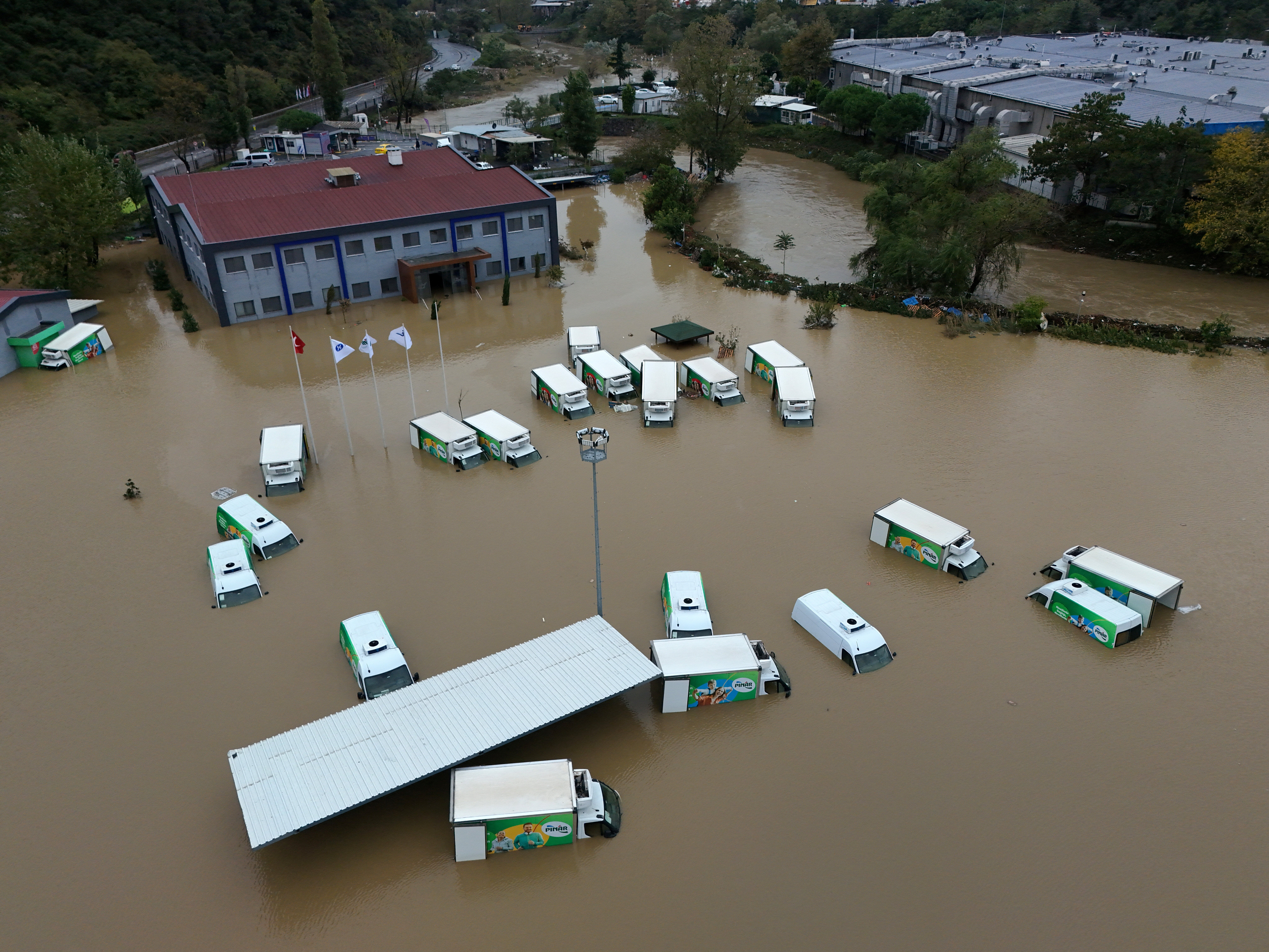 A drone view shows partially submerged lorries on a flooded street after heavy rains in Istanbul
