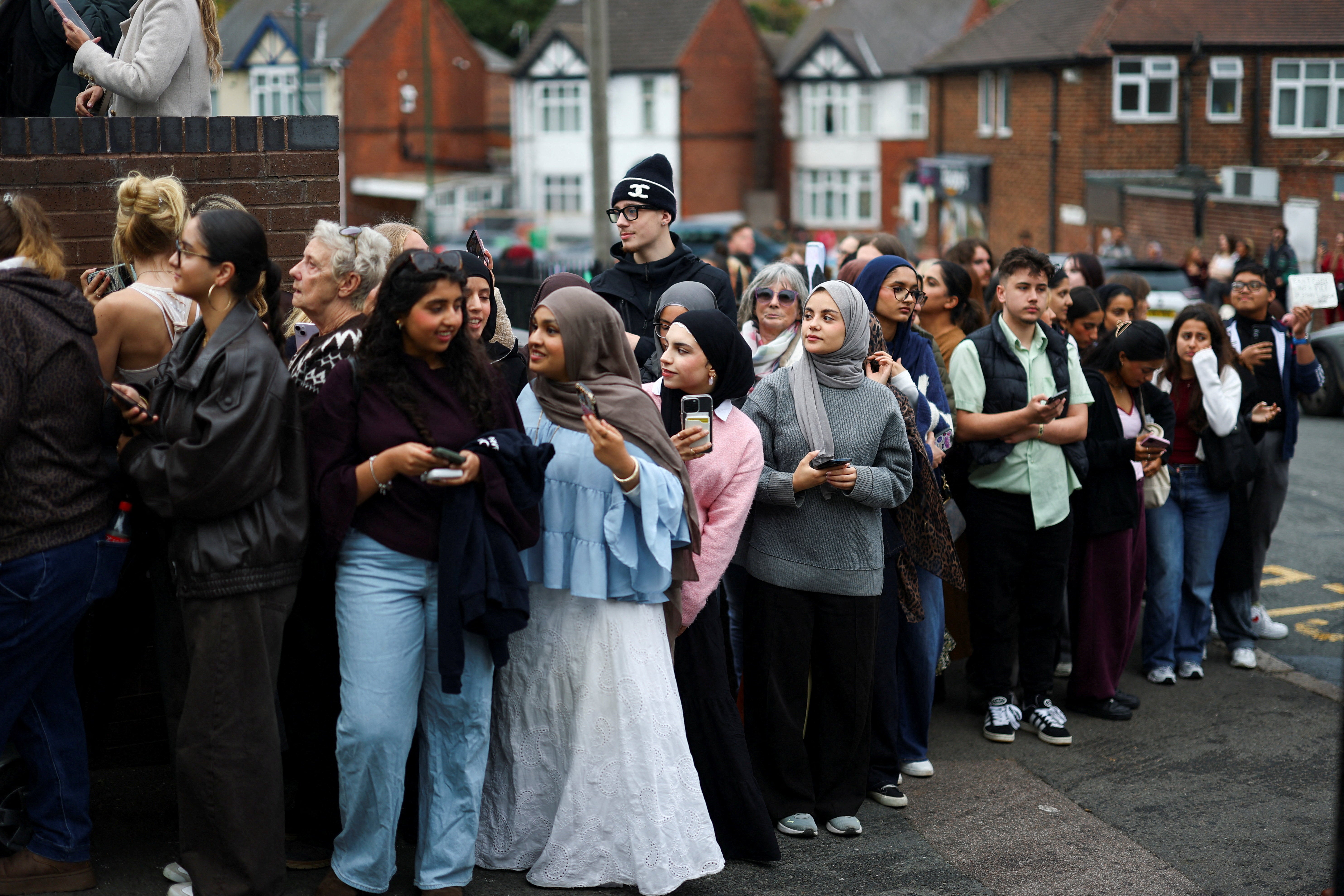 Crowds gather outside Epic Partners for the royal couple
