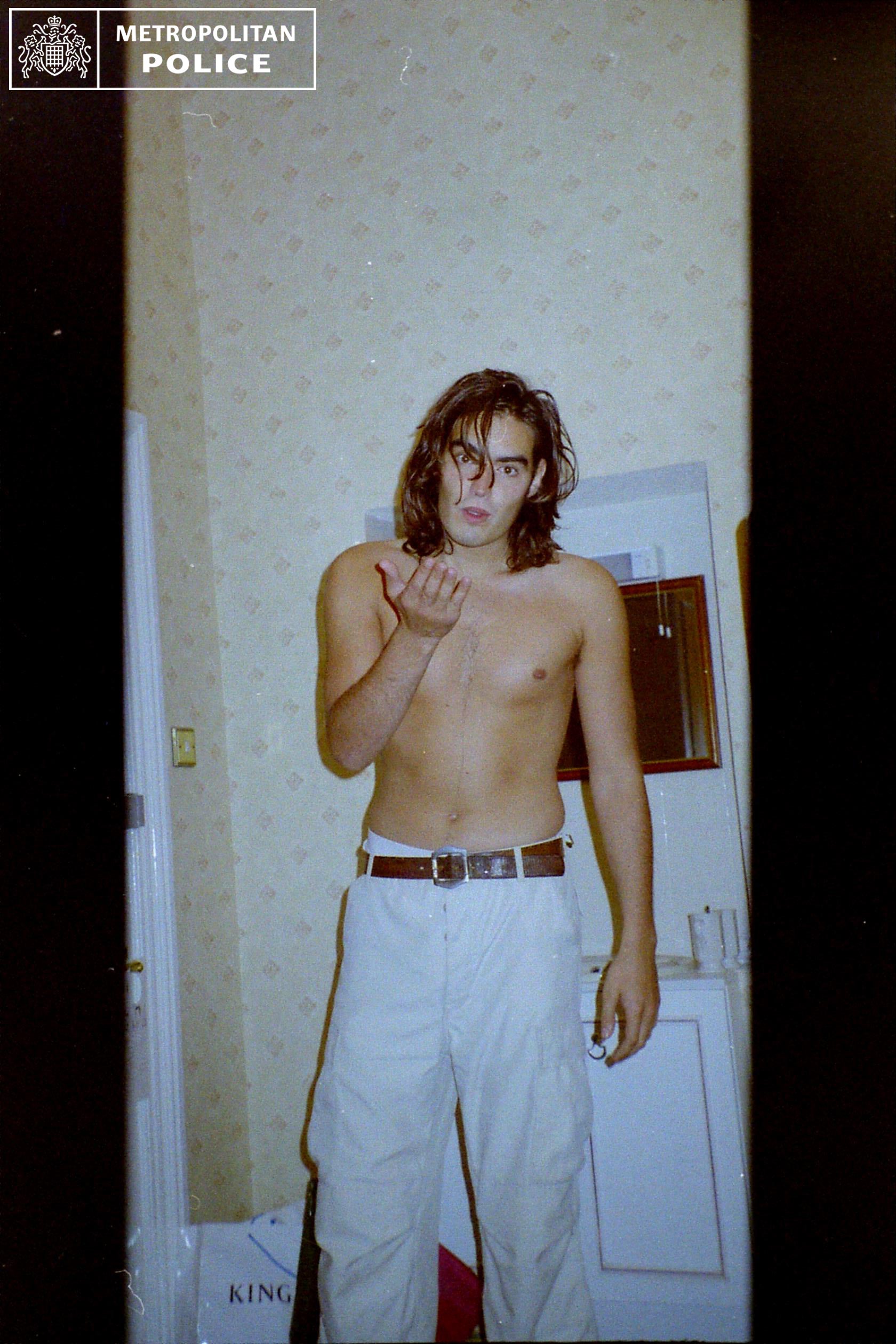 Brand appears to be performing a ‘blowing kiss’ motion in one of the photos