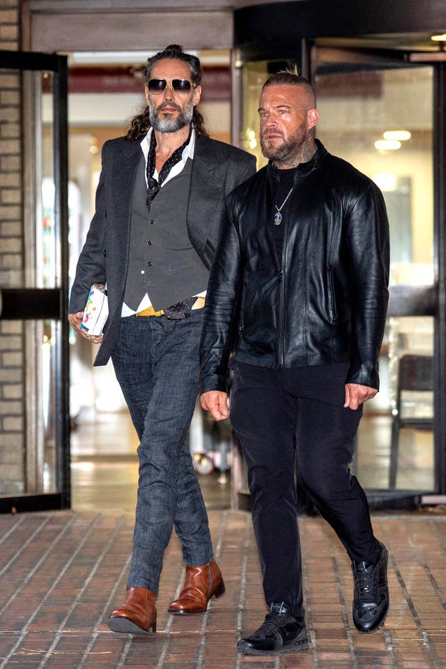 Brand leaving court with his bodyguard on Thursday