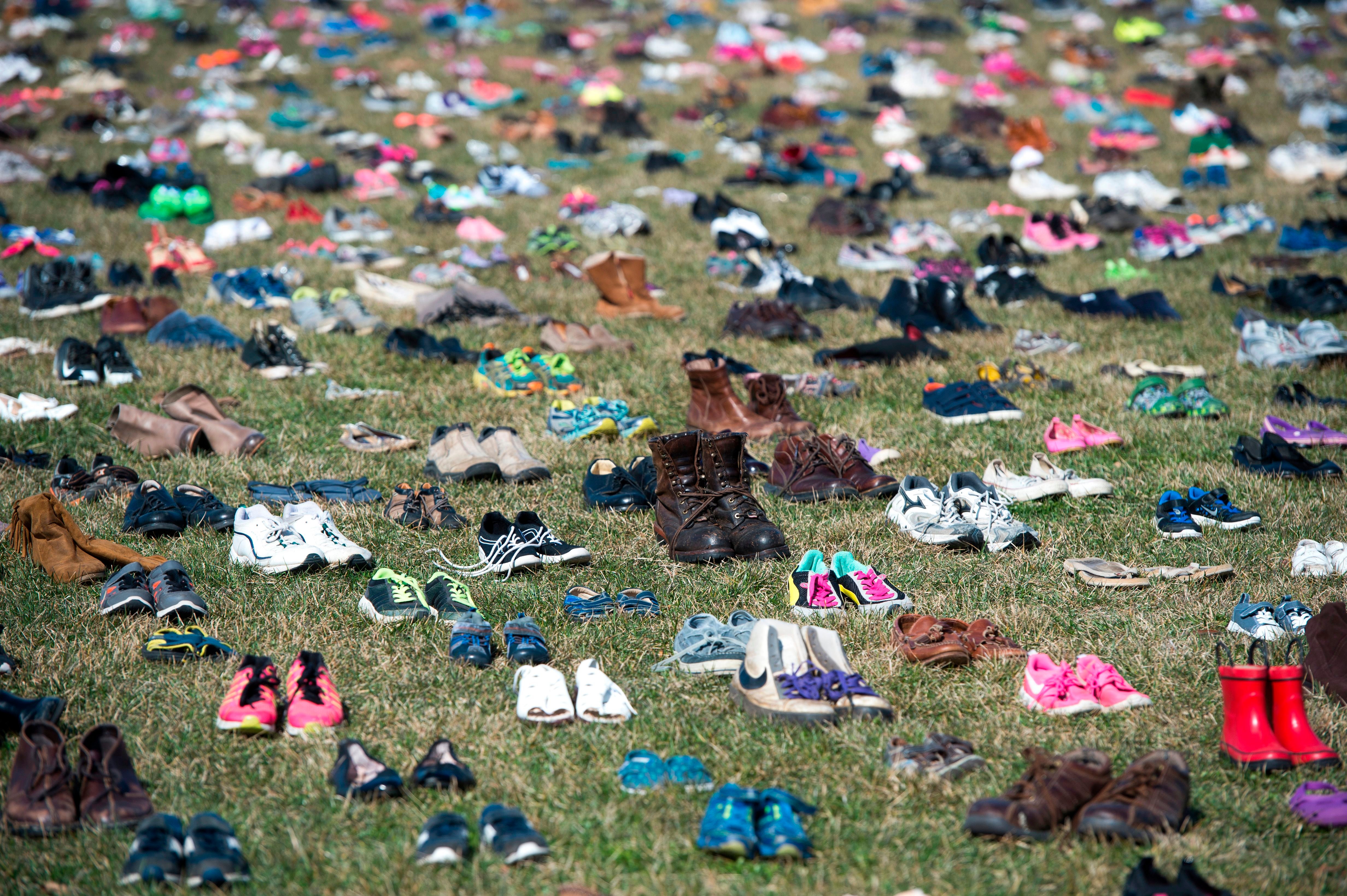 The lawn outside the US Capitol covered with 7,000 pairs of empty shoes to memorialise the 7,000 children killed by gun violence since the Sandy Hook shooting, in 2018