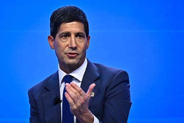 Chairman of the US Federal Reserve Kevin Warsh (R) speaks during a "fireside chat" with IMF Managing Director Kristalina Georgieva at the Annual Meetings of the International Monet