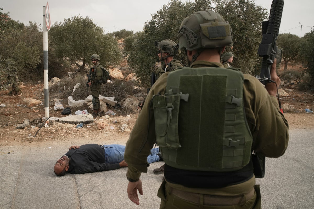 Photos show Israeli settler attacks disrupting the West Bank olive harvest