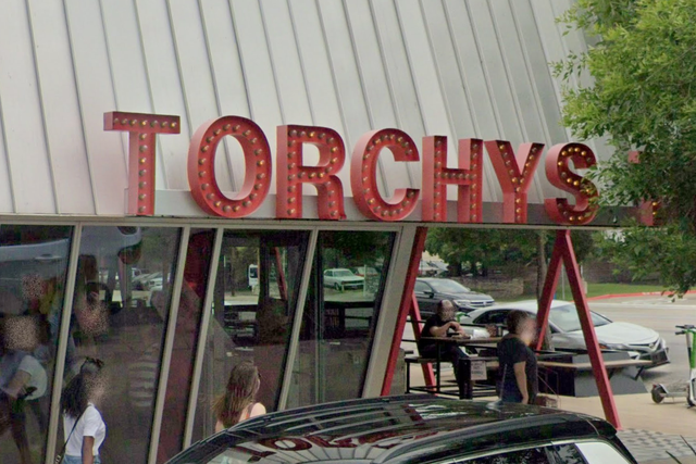 A woman says that she found a cow tooth in her take-out meal from Torchy's Tacos in Austin (pictured) and has now filed a lawsuit over it
