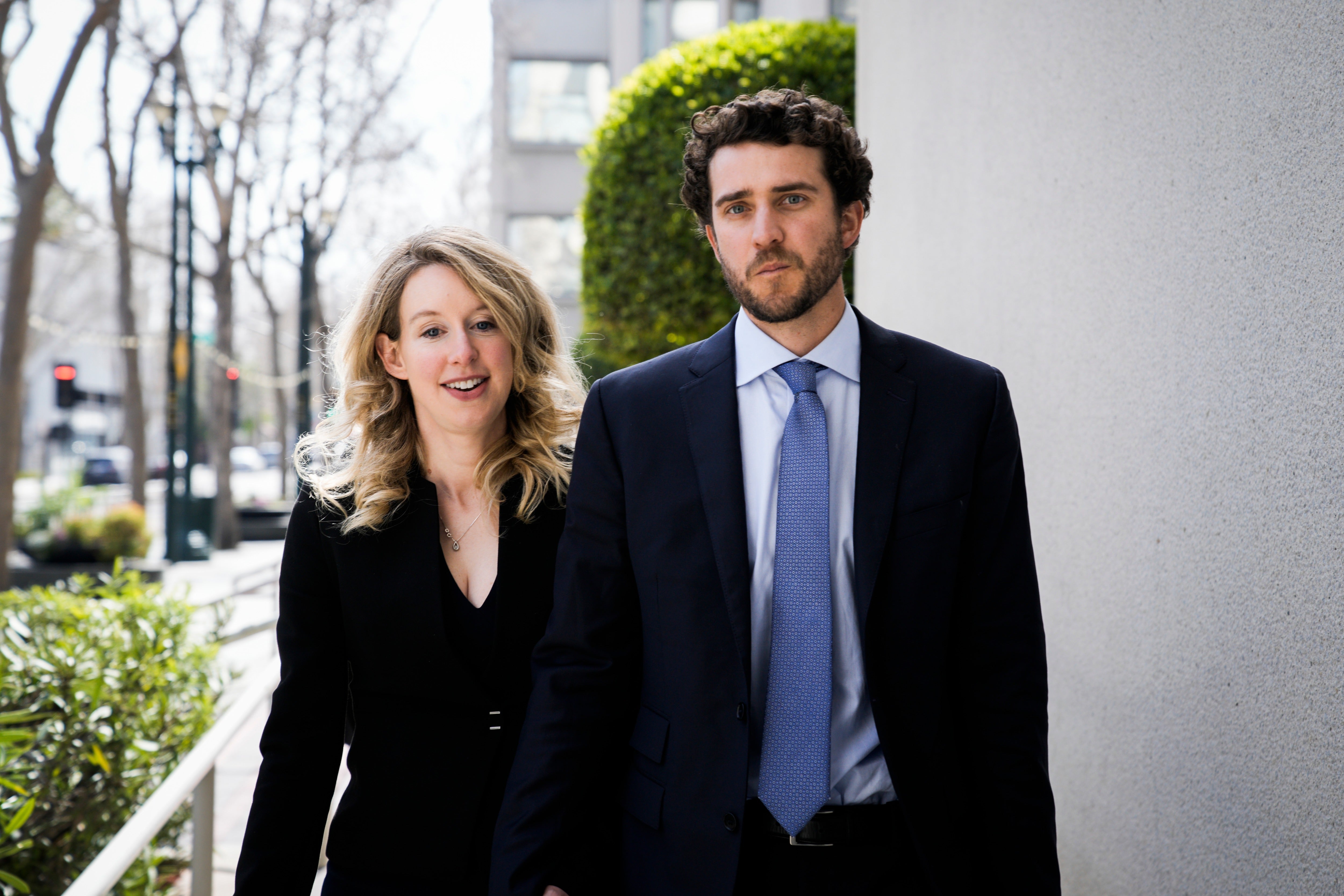 Elizabeth Holmes and her partner Billy Evans, pictured leaving a hearing in San Jose in 2023