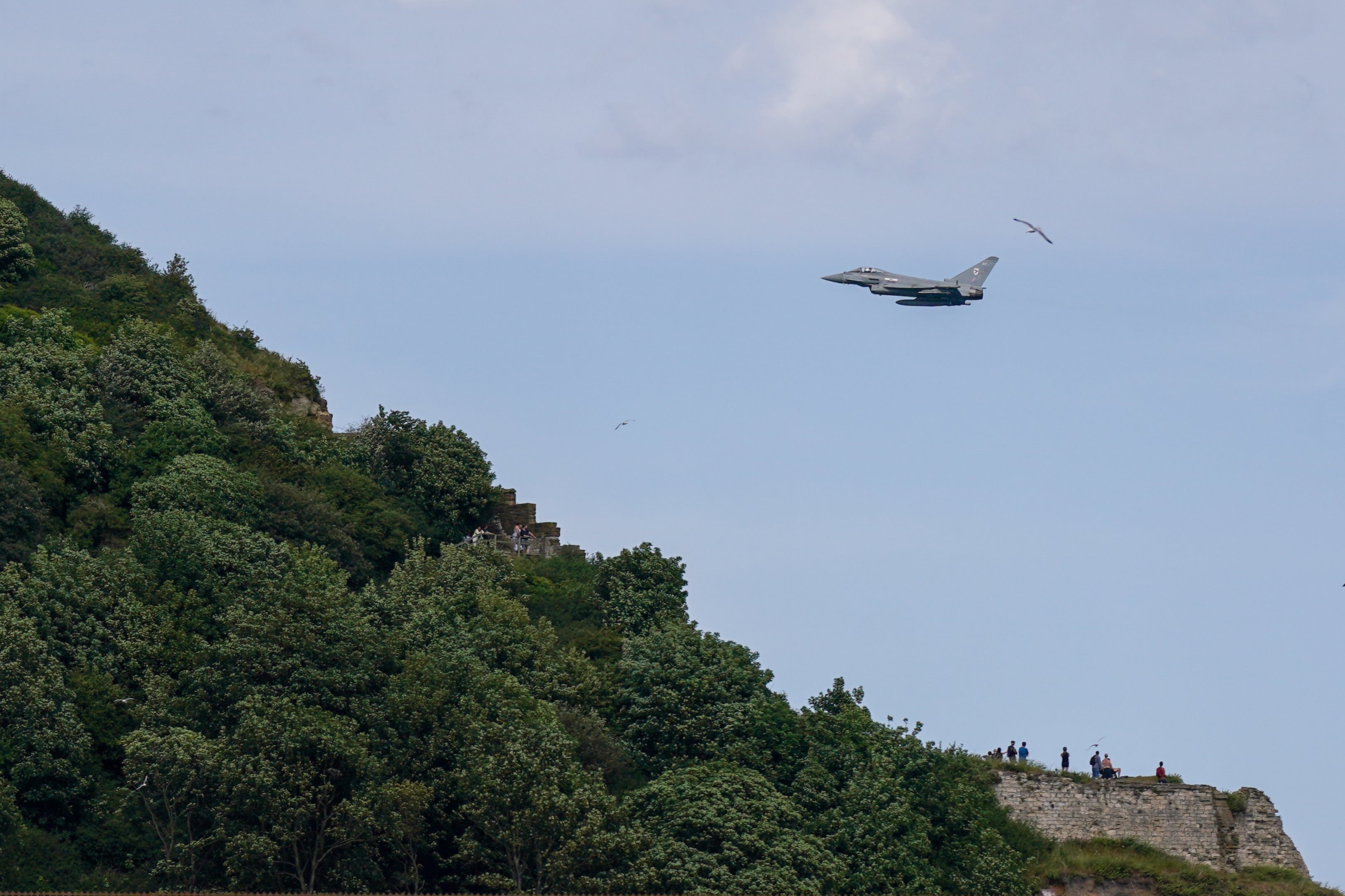 A Royal Air Force Eurofighter Typhoon FGR4 conducts a display for spectators during Scarborough Armed Forces Day