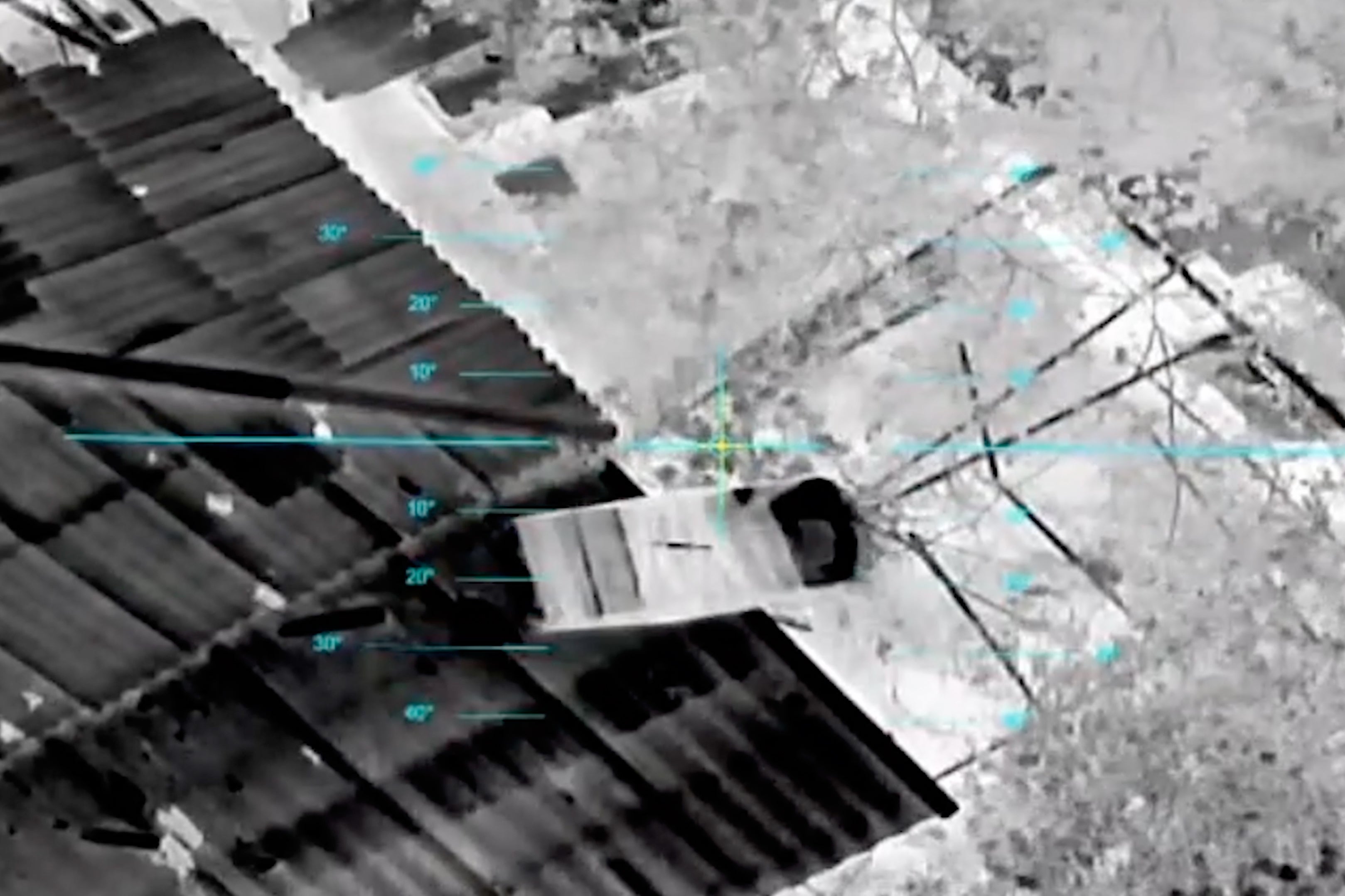 A drone drops a parcel of supplies to civilians in the Russian-occupied city of Oleshky in the Kherson region of Ukraine