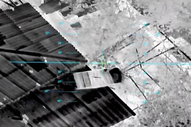 A drone drops a parcel of supplies to civilians in the Russian-occupied city of Oleshky in the Kherson region of Ukraine